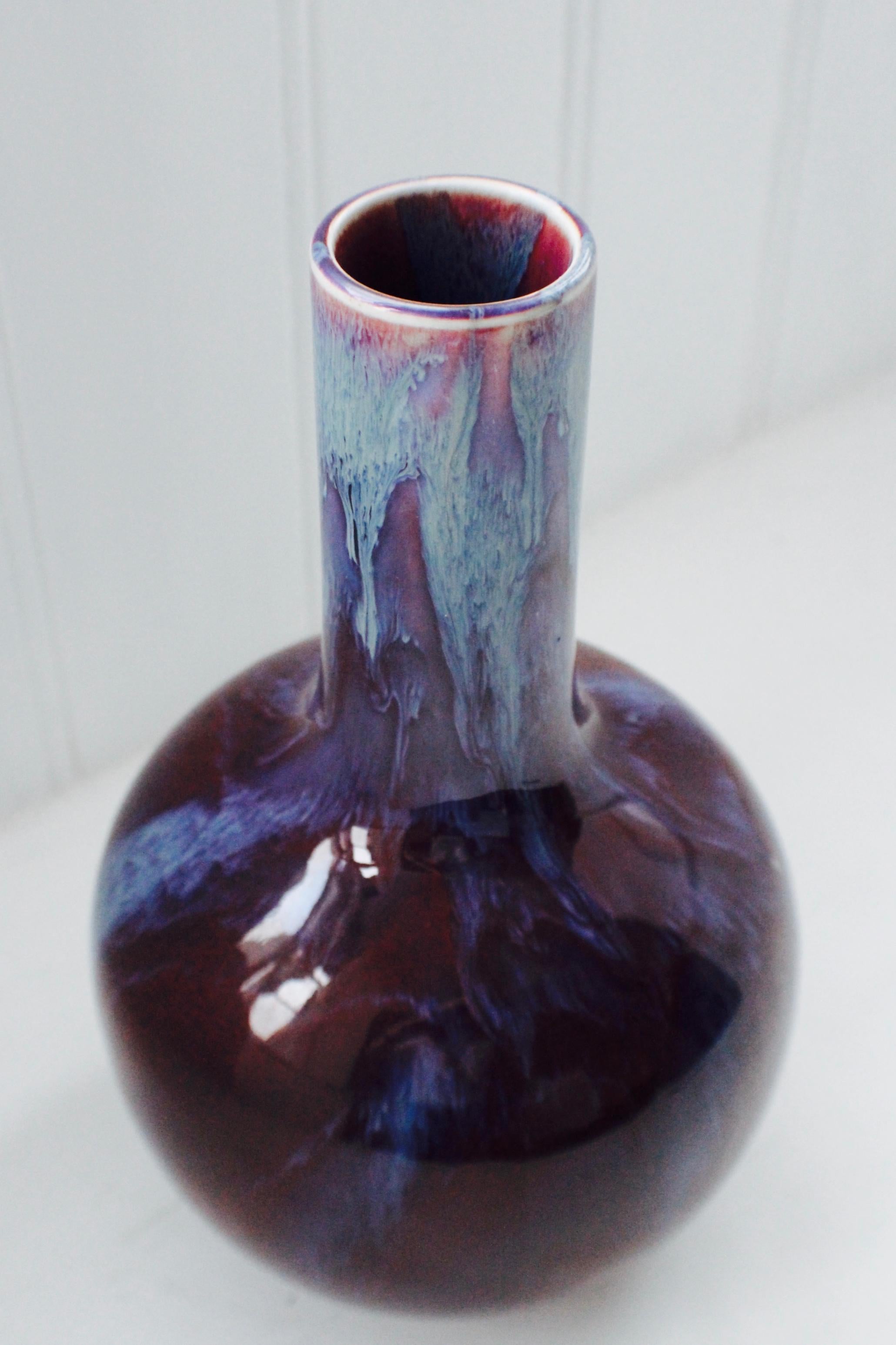 A Chinese flambe glazed bottle vase with Jingdezhen Zhi seal mark, 20th century, in Qing style, with a purple-streaked upper section, seal mark in underglaze blue.