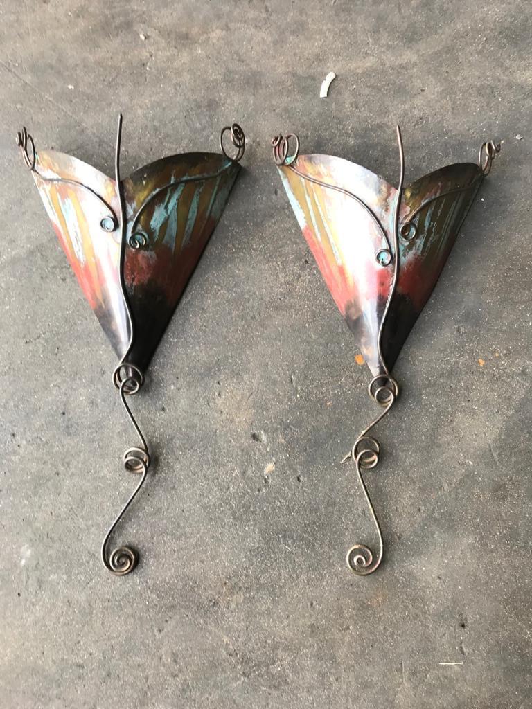 A 20th century English pair of copper Hammered wall lights. Possibly done by Mark Brazier-Jones. These unique lights come from a fine house in Mayfair, London. They were removed in the 80's in between refurbishment of the house and have been stored