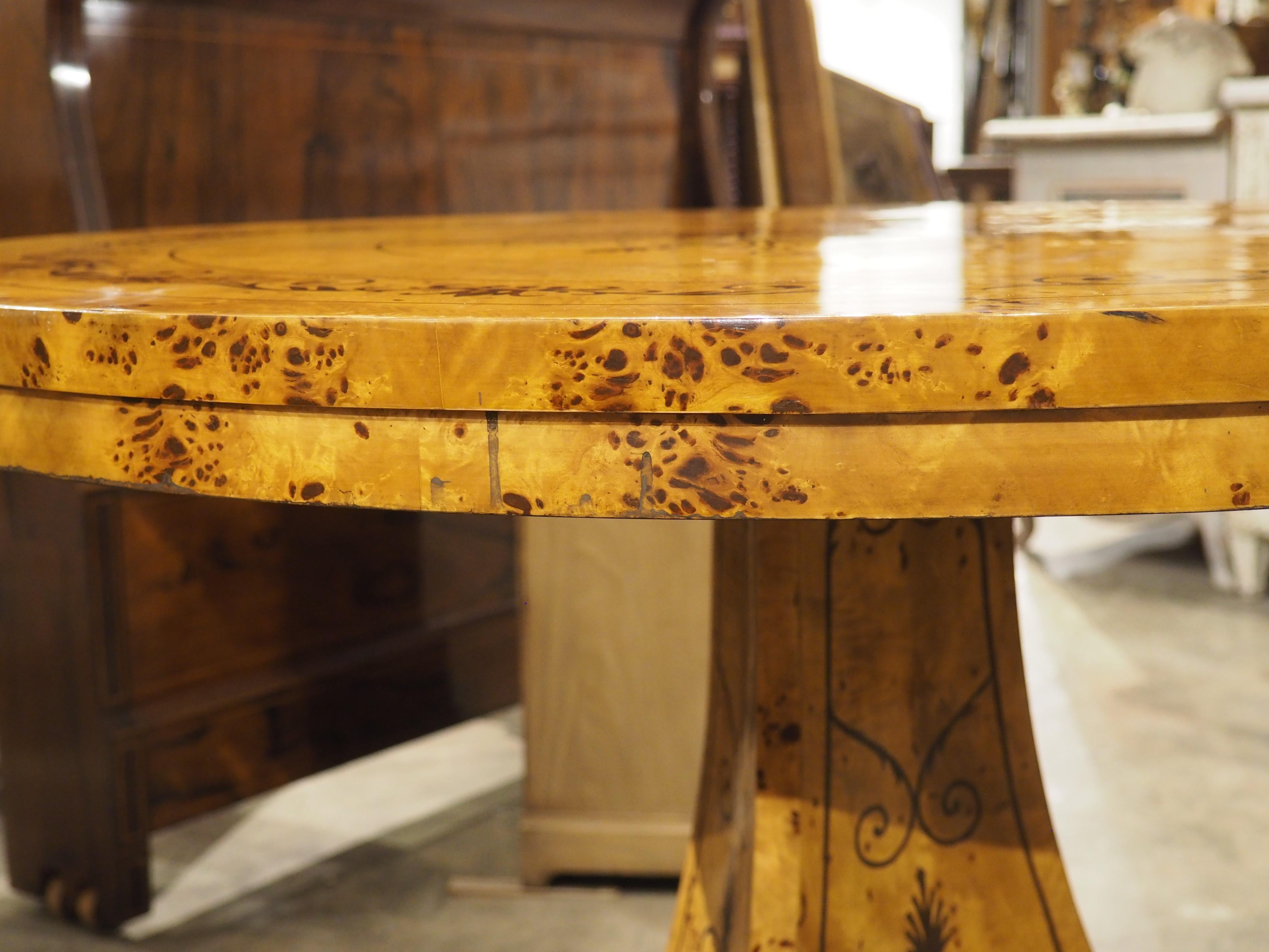 A 20th Century French Charles X Style Center Table with Marquetry Decor 5