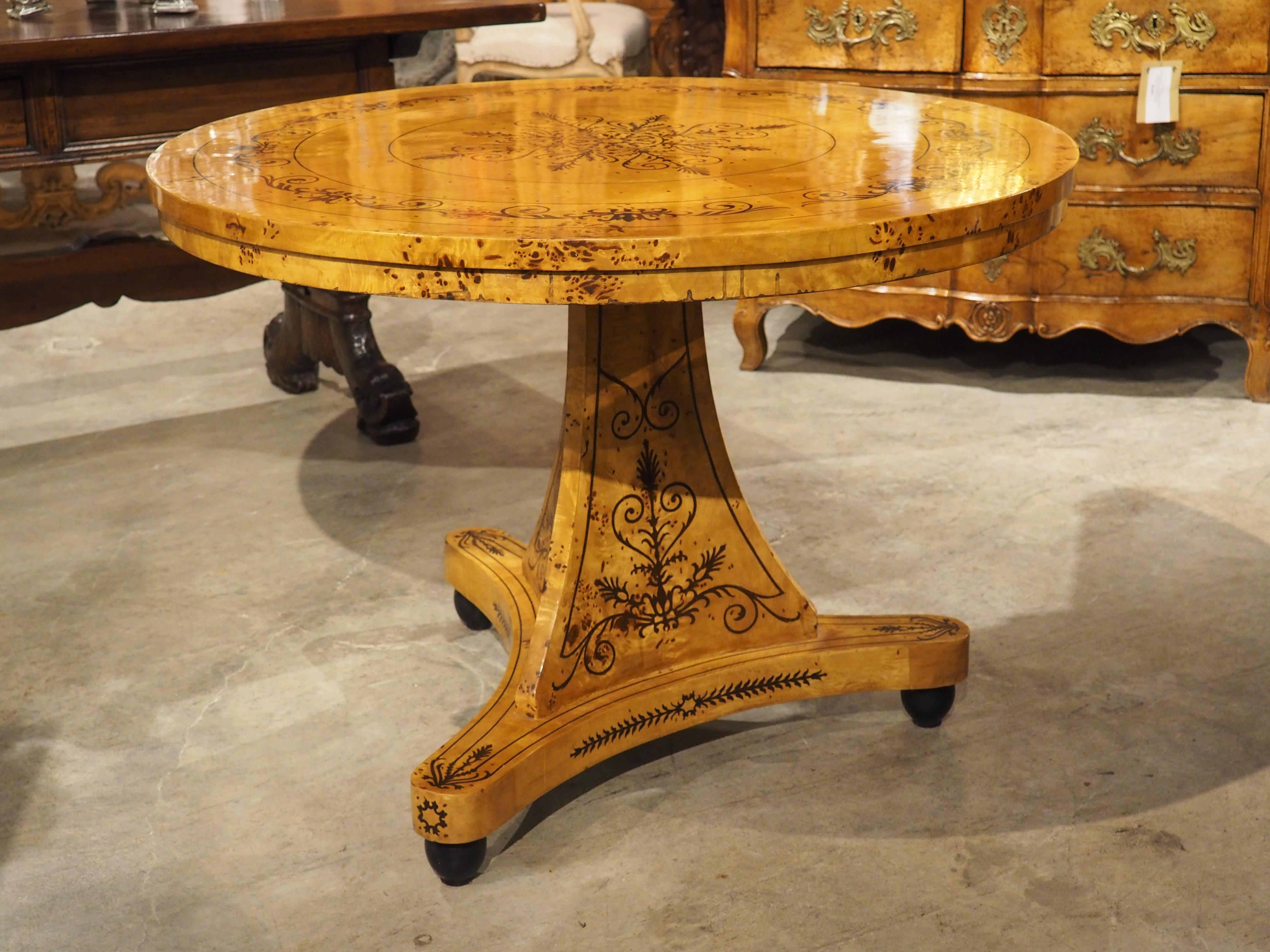 A 20th Century French Charles X Style Center Table with Marquetry Decor 8
