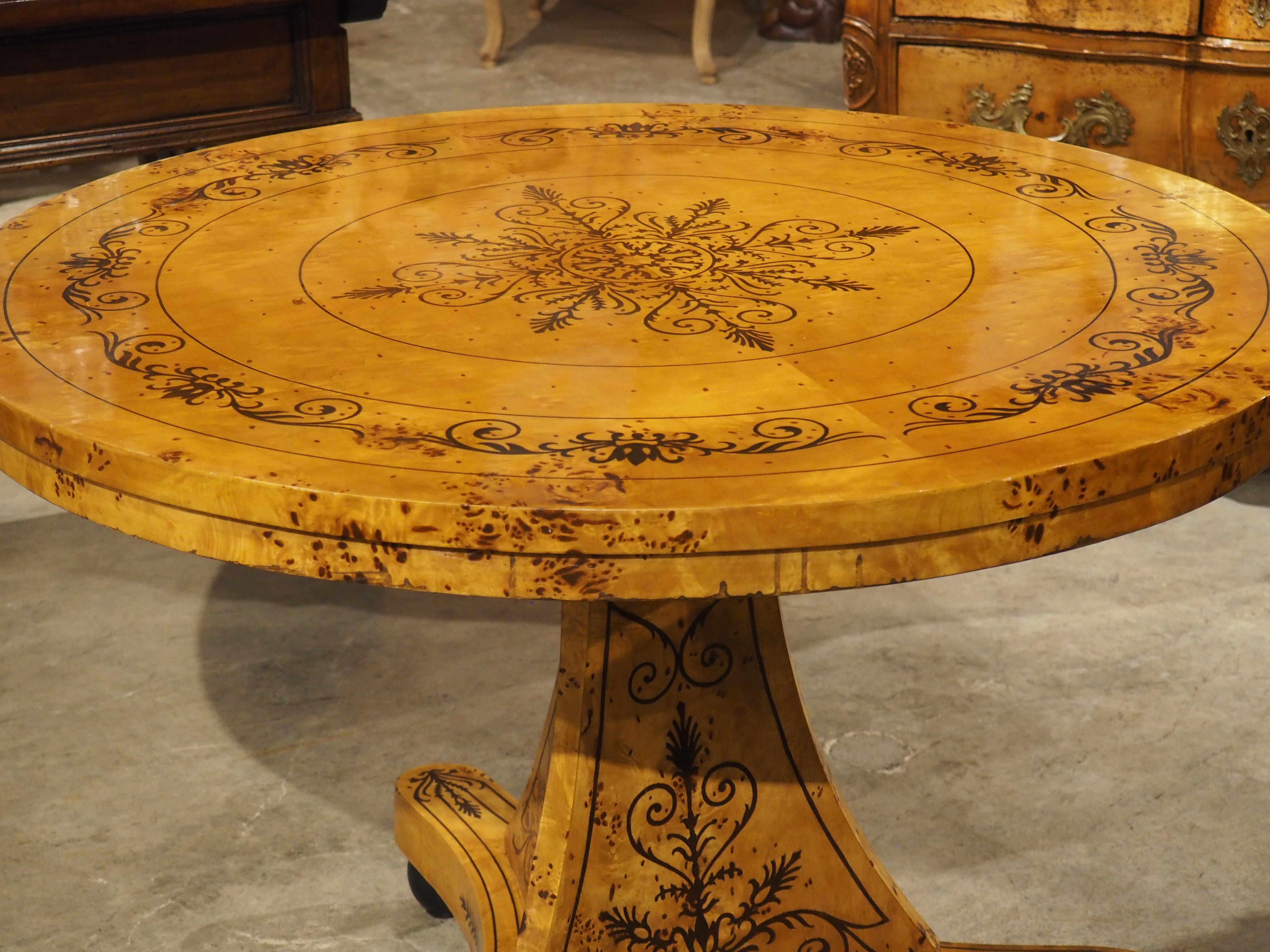A 20th Century French Charles X Style Center Table with Marquetry Decor 9