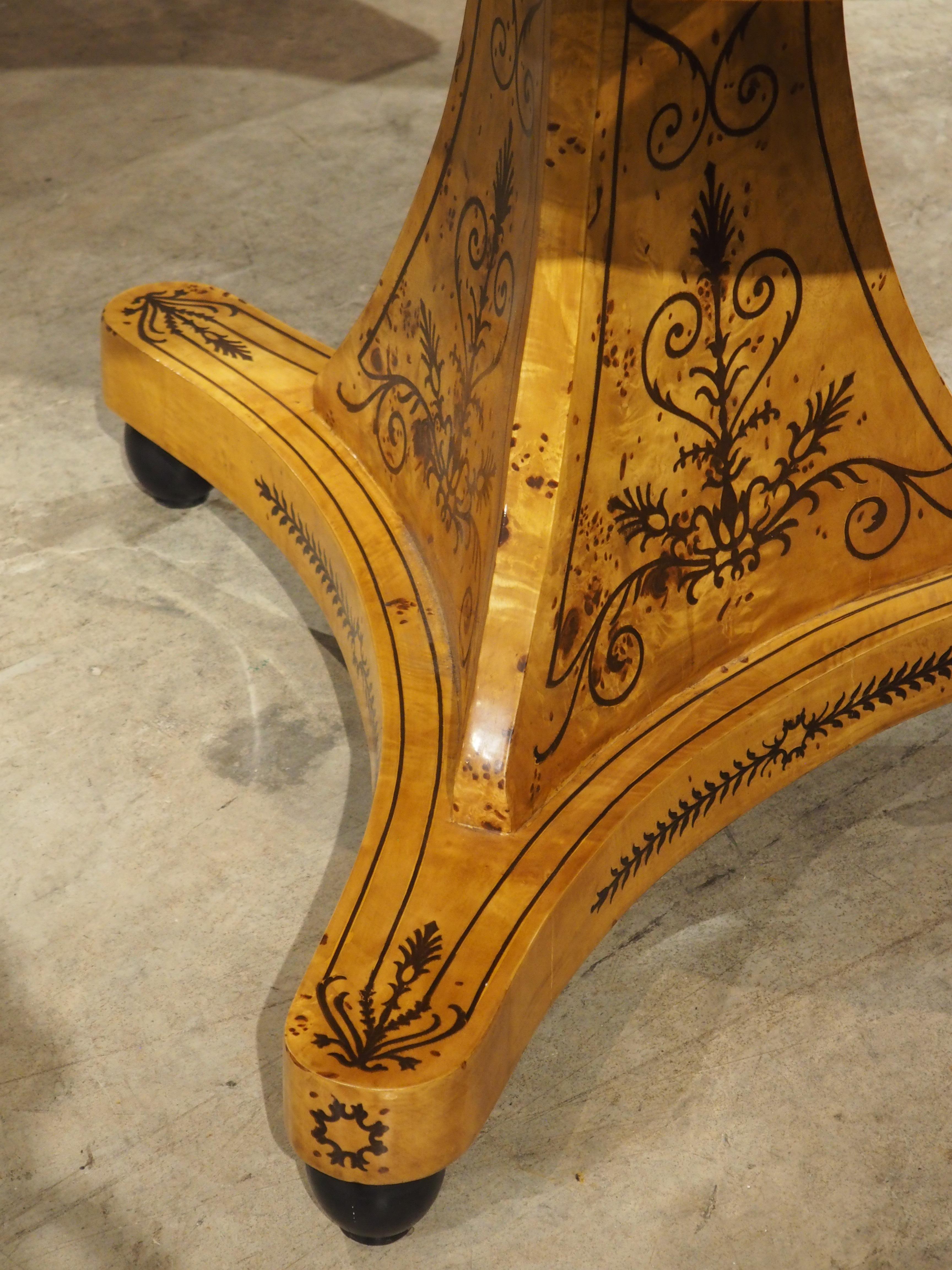 A 20th Century French Charles X Style Center Table with Marquetry Decor 10