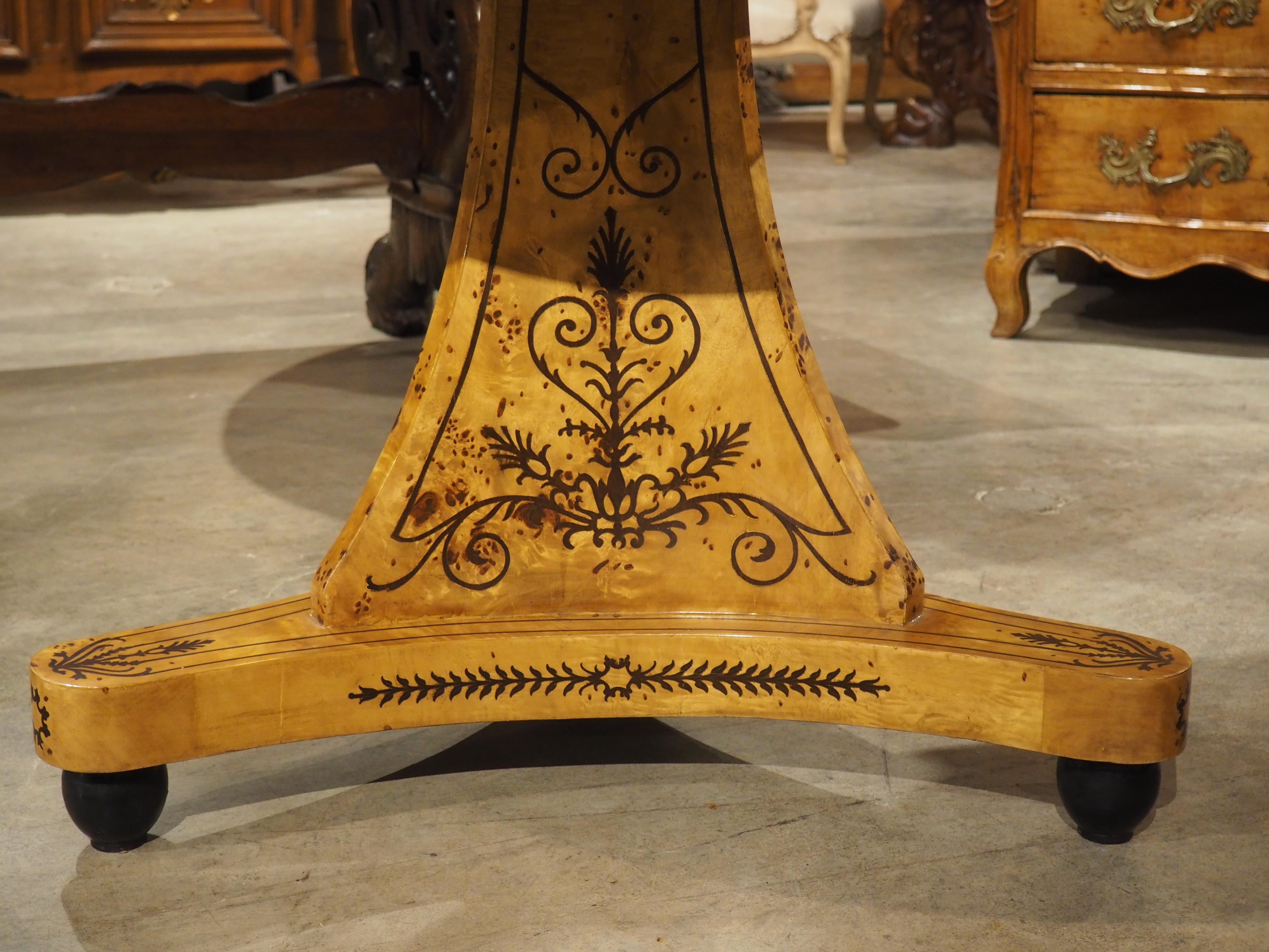 A 20th Century French Charles X Style Center Table with Marquetry Decor 11