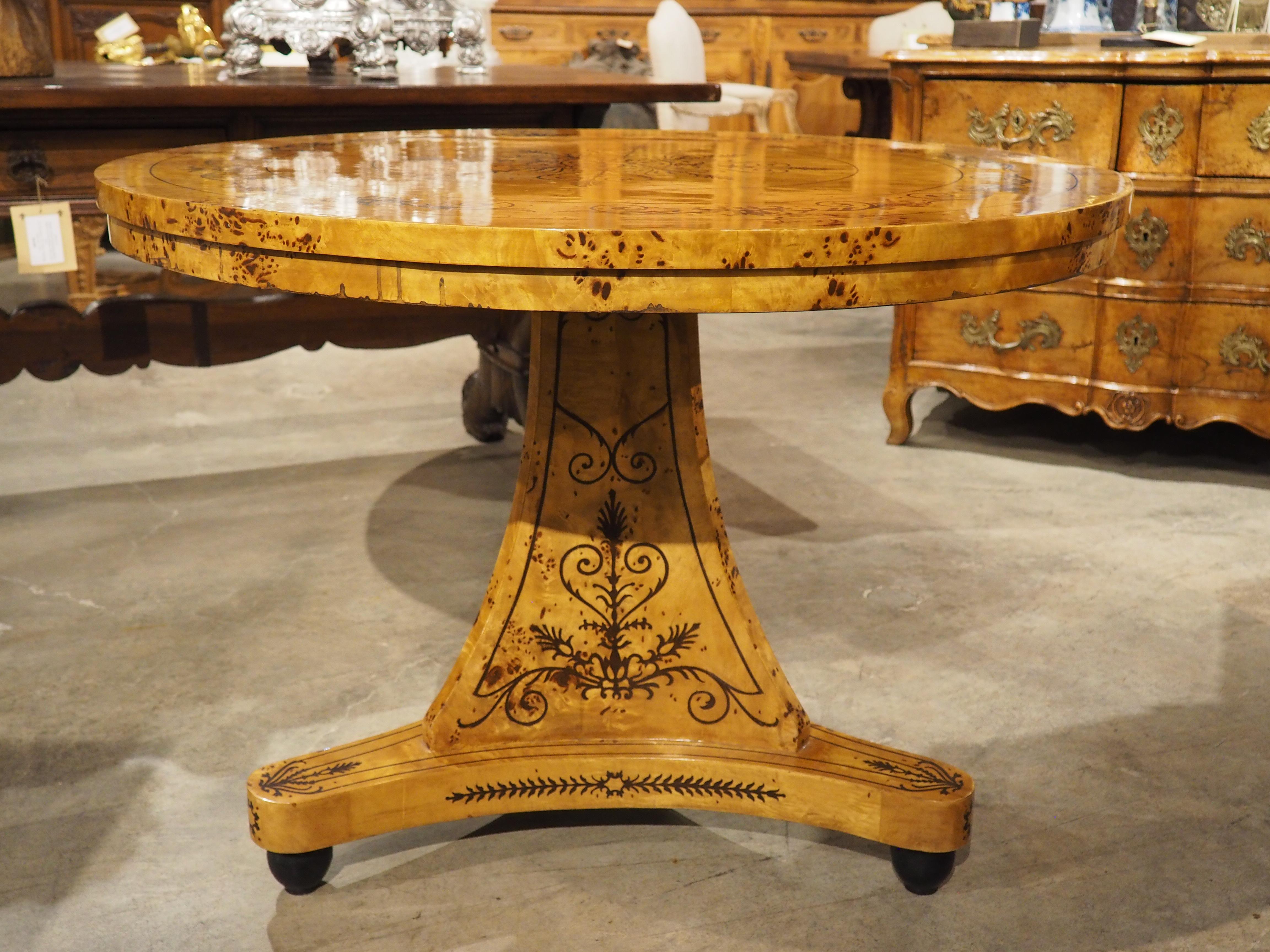 A 20th Century French Charles X Style Center Table with Marquetry Decor 12