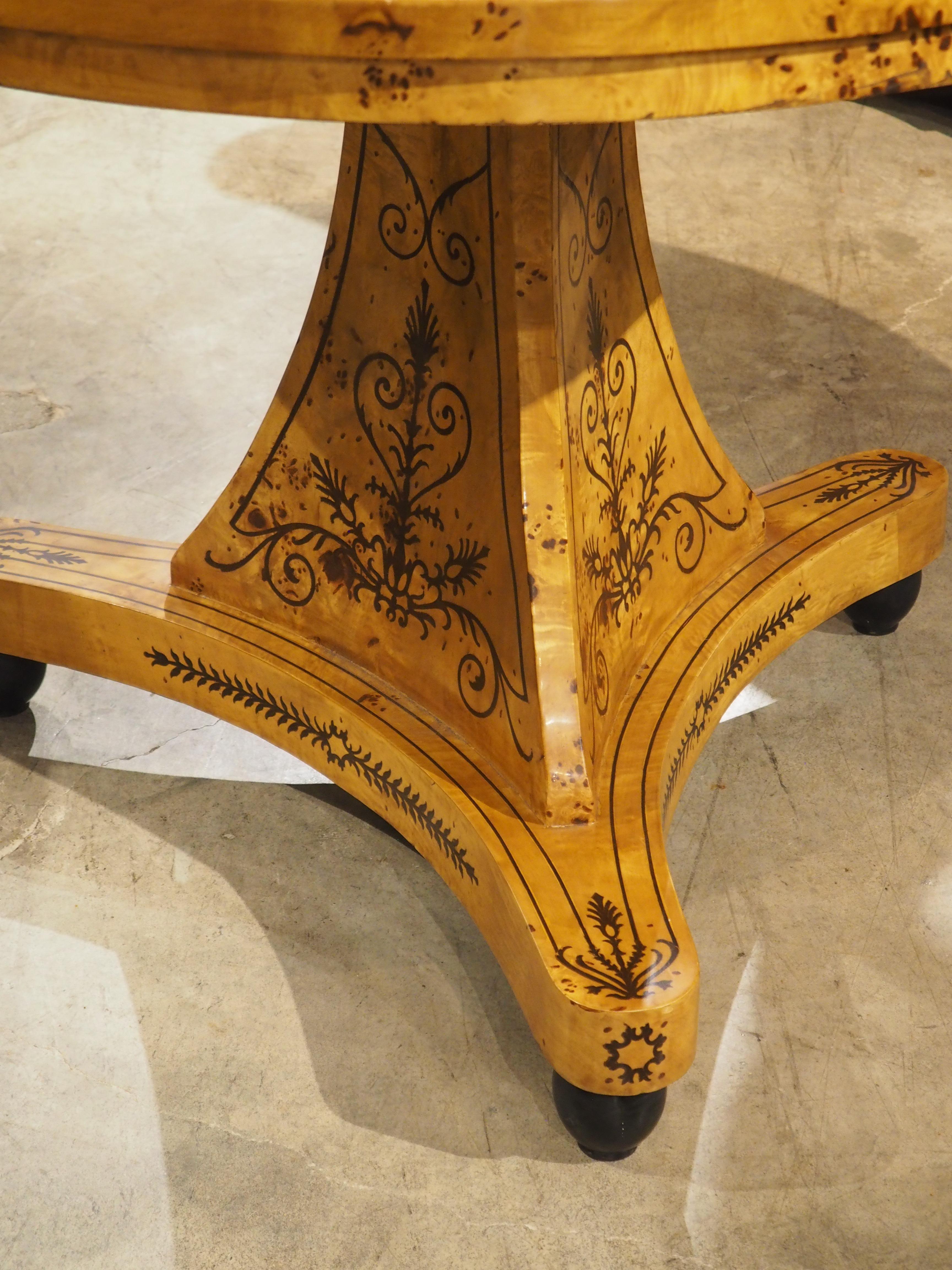 A 20th Century French Charles X Style Center Table with Marquetry Decor 13