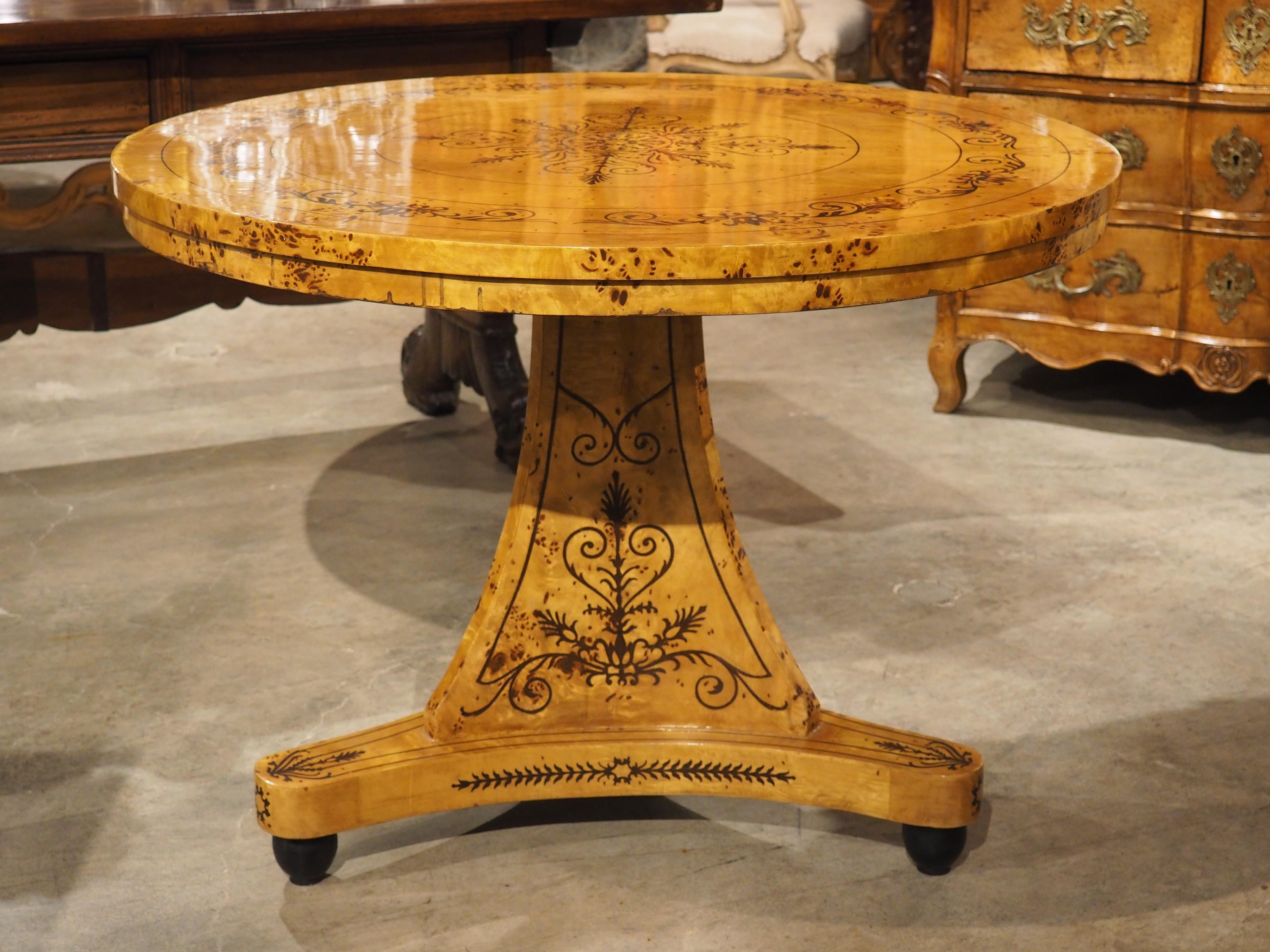 A 20th Century French Charles X Style Center Table with Marquetry Decor 15