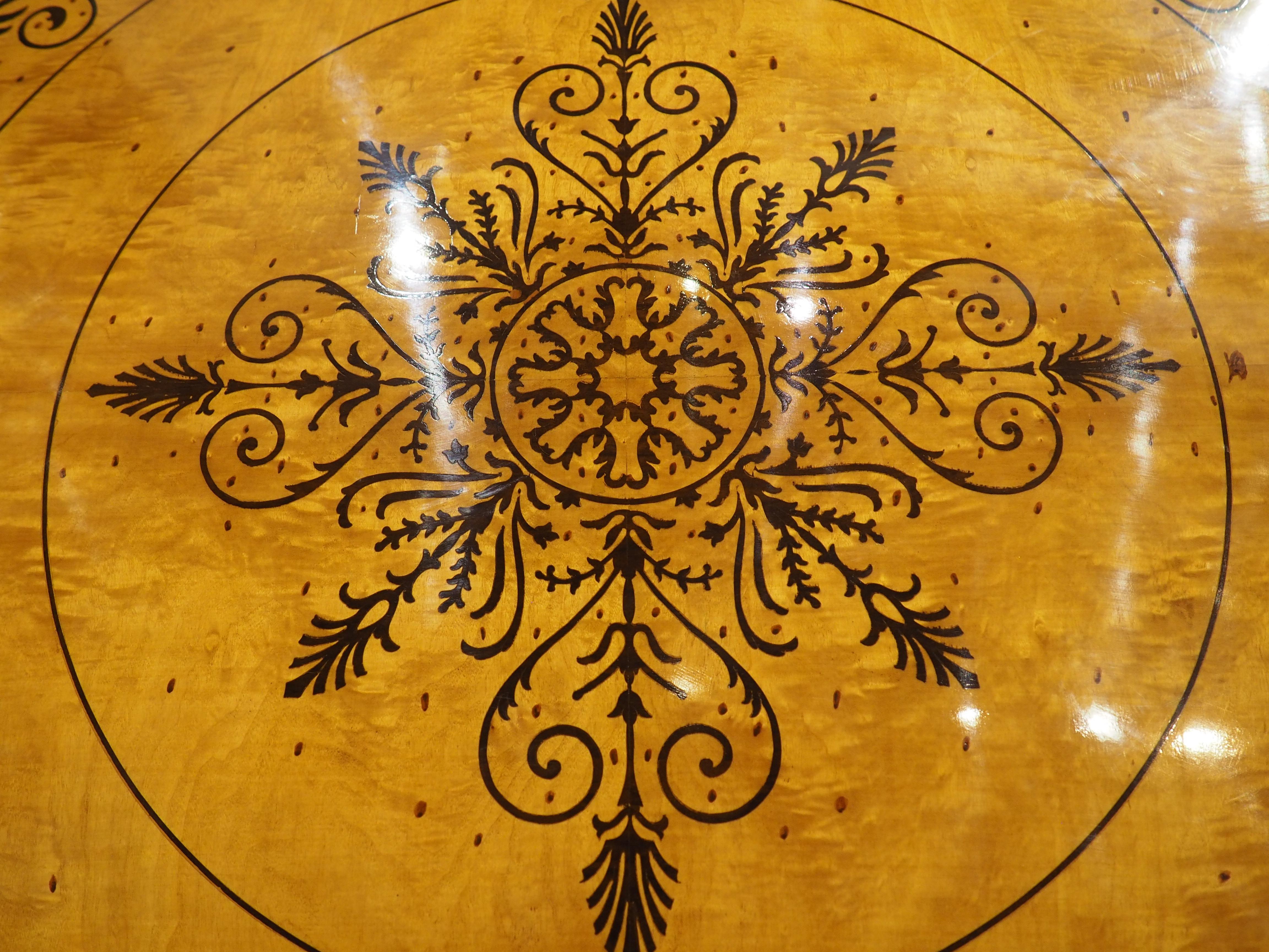A 20th Century French Charles X Style Center Table with Marquetry Decor In Good Condition In Dallas, TX