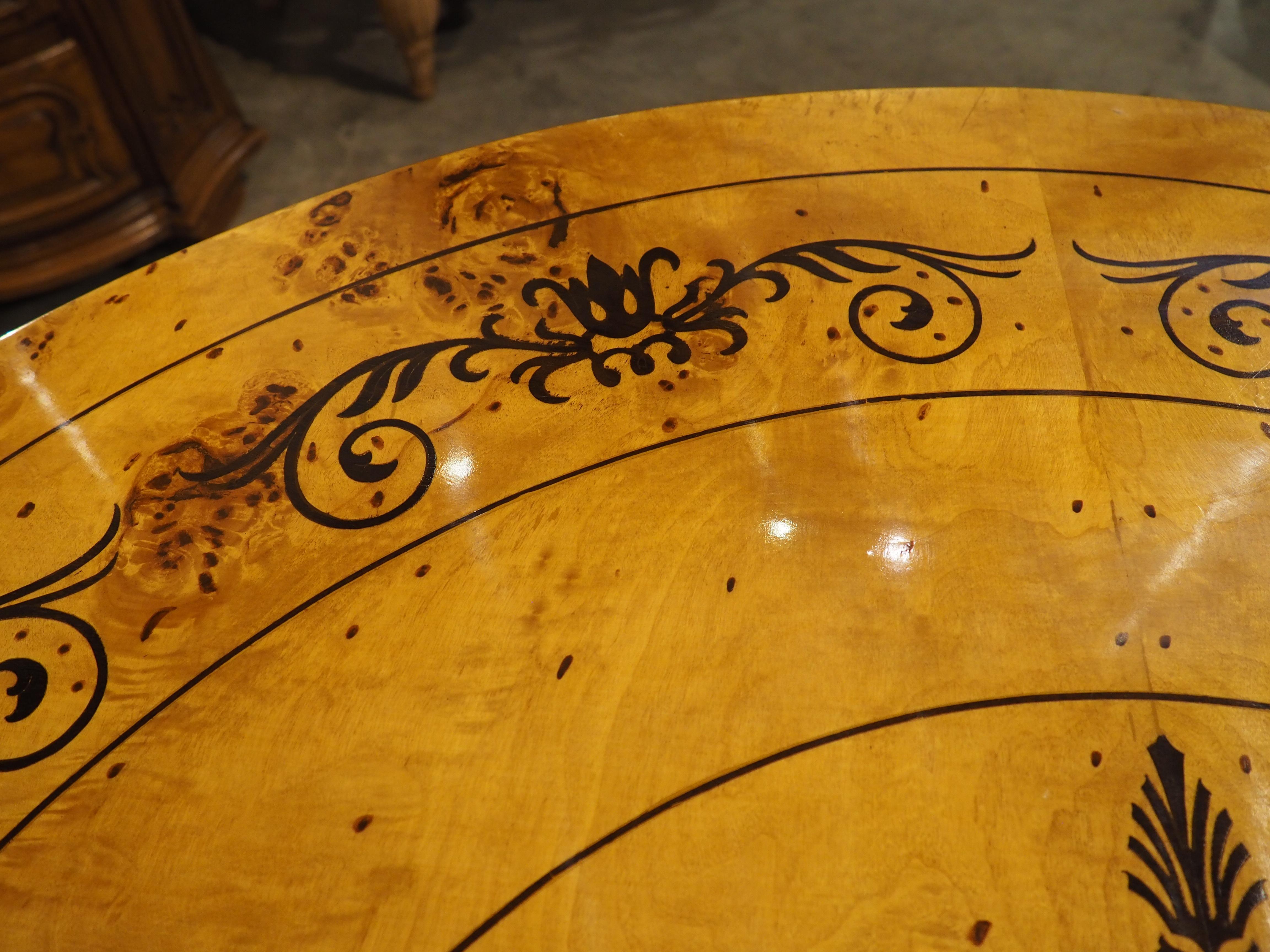 Wood A 20th Century French Charles X Style Center Table with Marquetry Decor