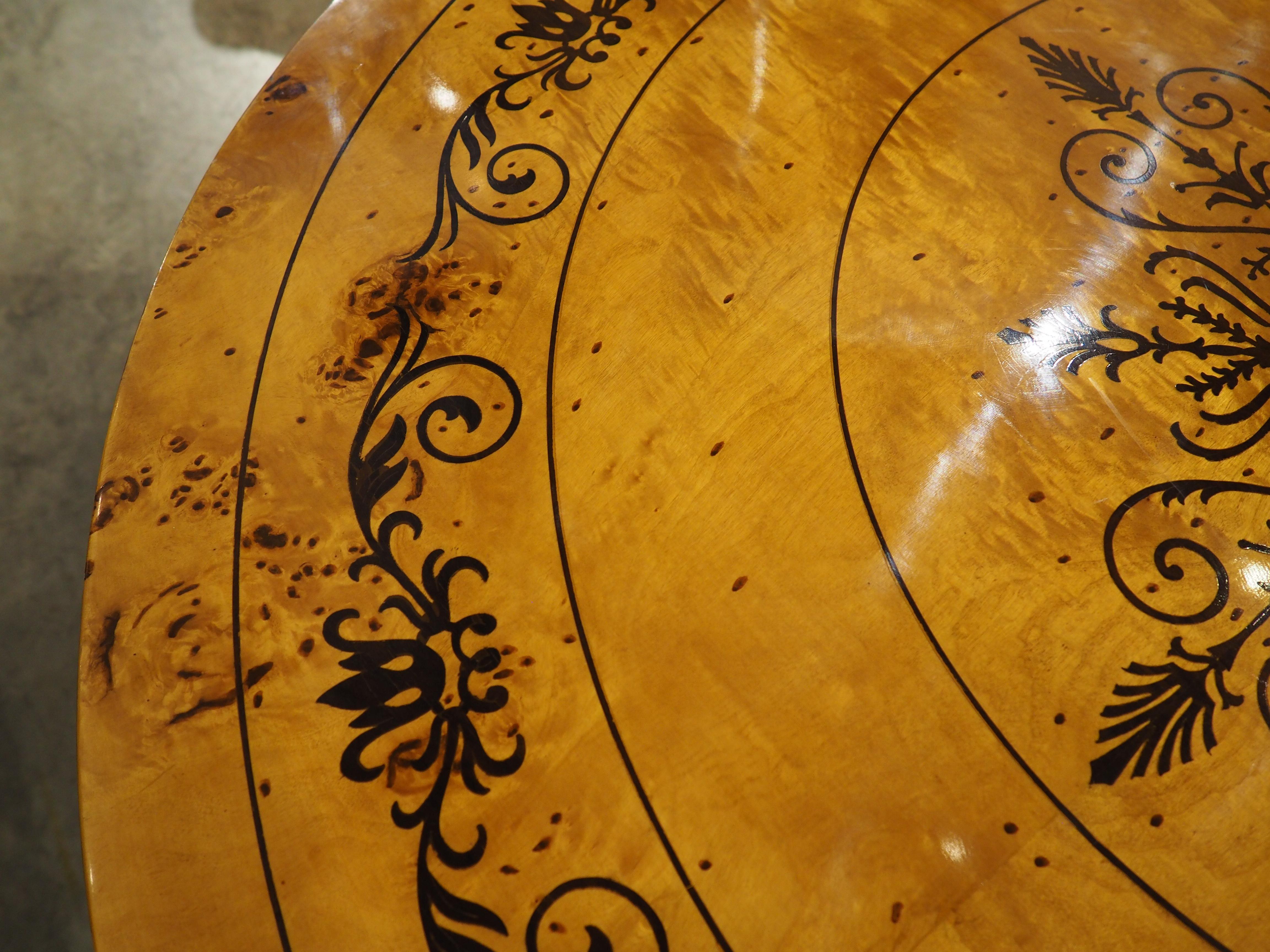 A 20th Century French Charles X Style Center Table with Marquetry Decor 1