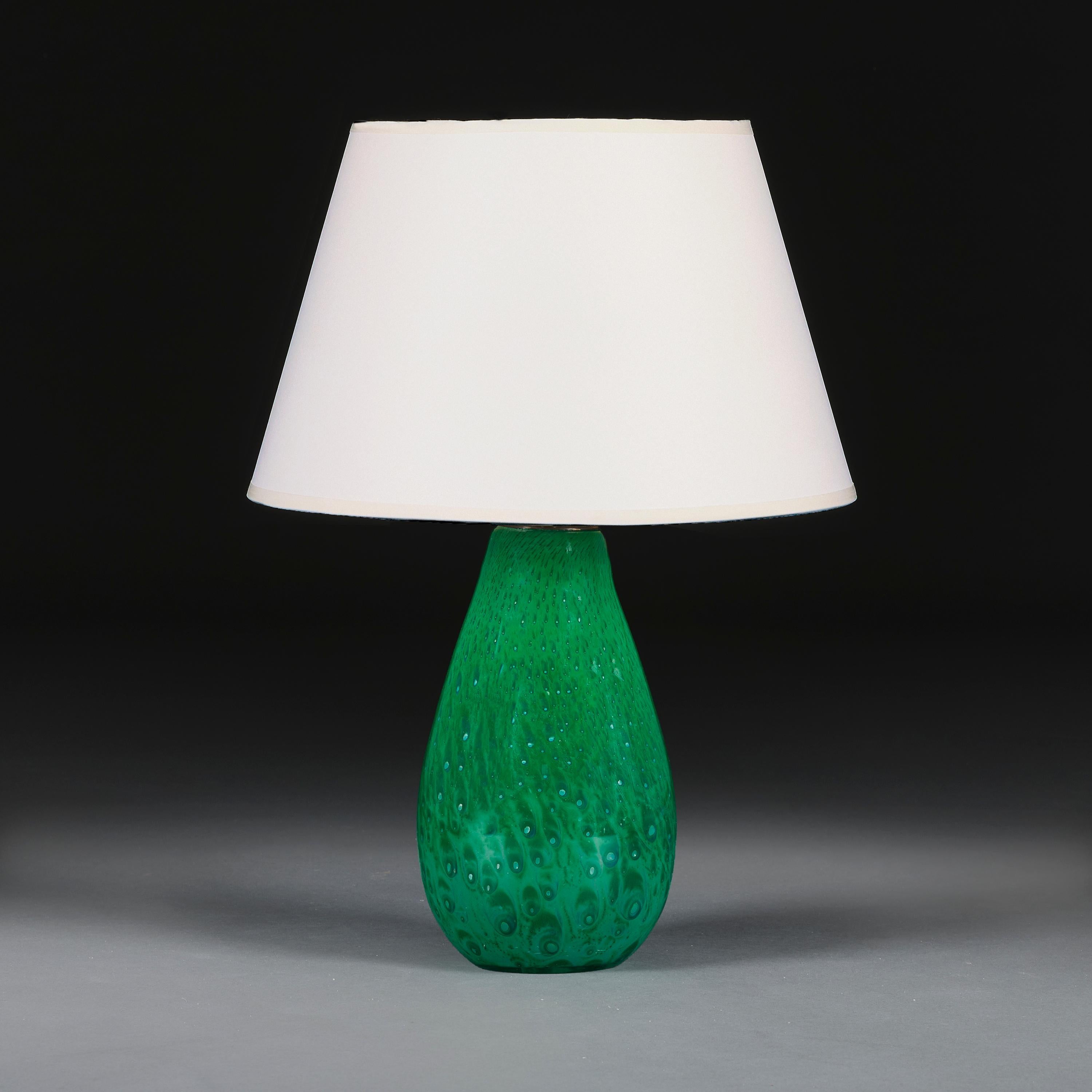 Italy, circa 1960

A vibrant green Murano glass teardrop vase with bullicante bubbles throughout, now converted as a lamp.

Height of vase 26.00cm

Width of body 14.00cm

Please note:

Lampshade not included. Lamp photographed with a 14” diameter