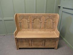 A 20th Century High Back Oak Box Settle The Settle has 3 carved back panels