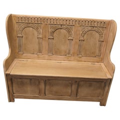 A 20th Century High Back Oak Box Settle The Settle has 3 carved back panels