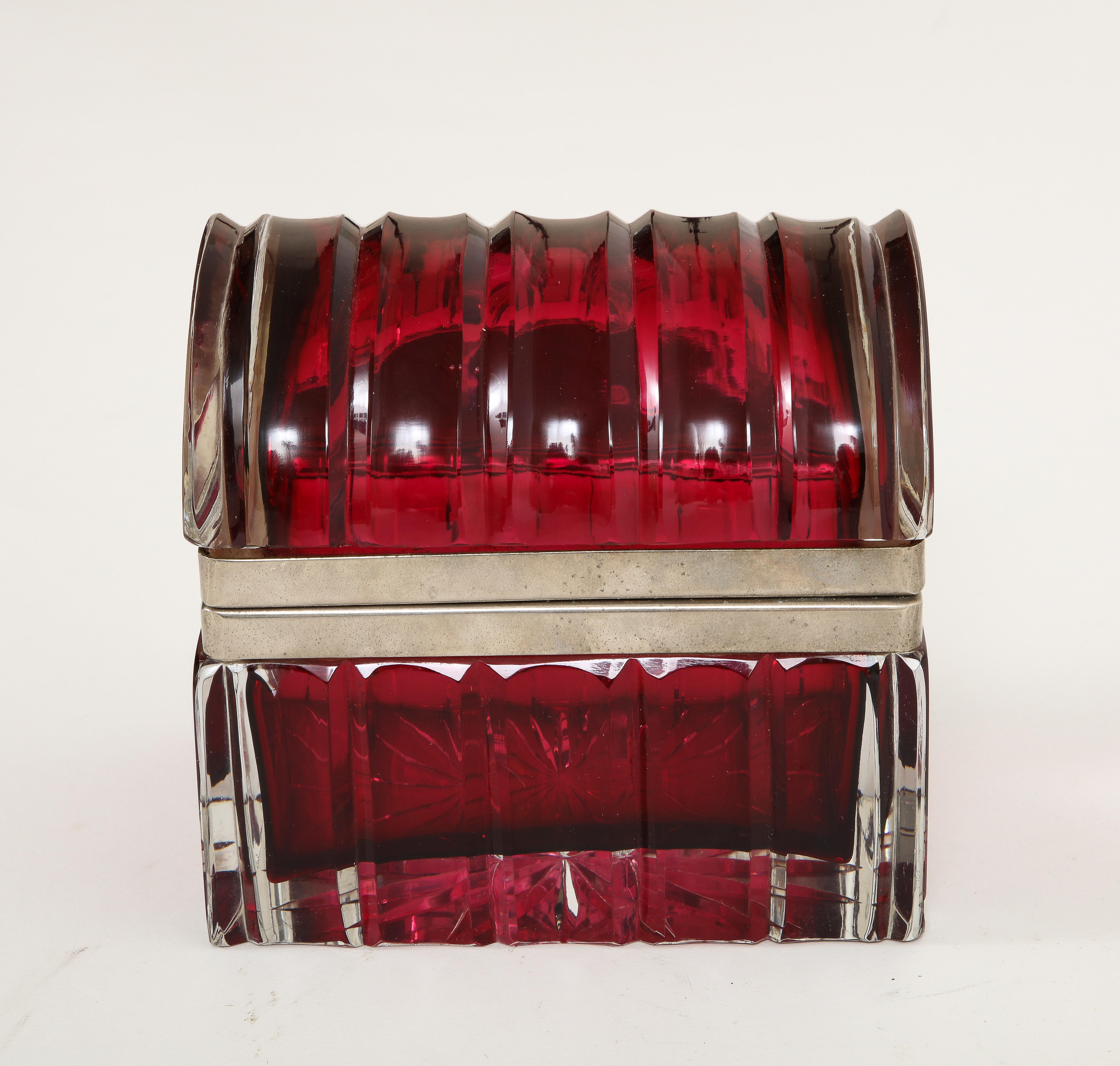 An Unusual 20th Century Italian Silvered Bronze Mounted Clear-Over-red crystal box The box is composed of two sections of Italian clear-over-red crystal which are mounted to a fabulous silvered bronze latch. The silvered bronze is beautiful with a
