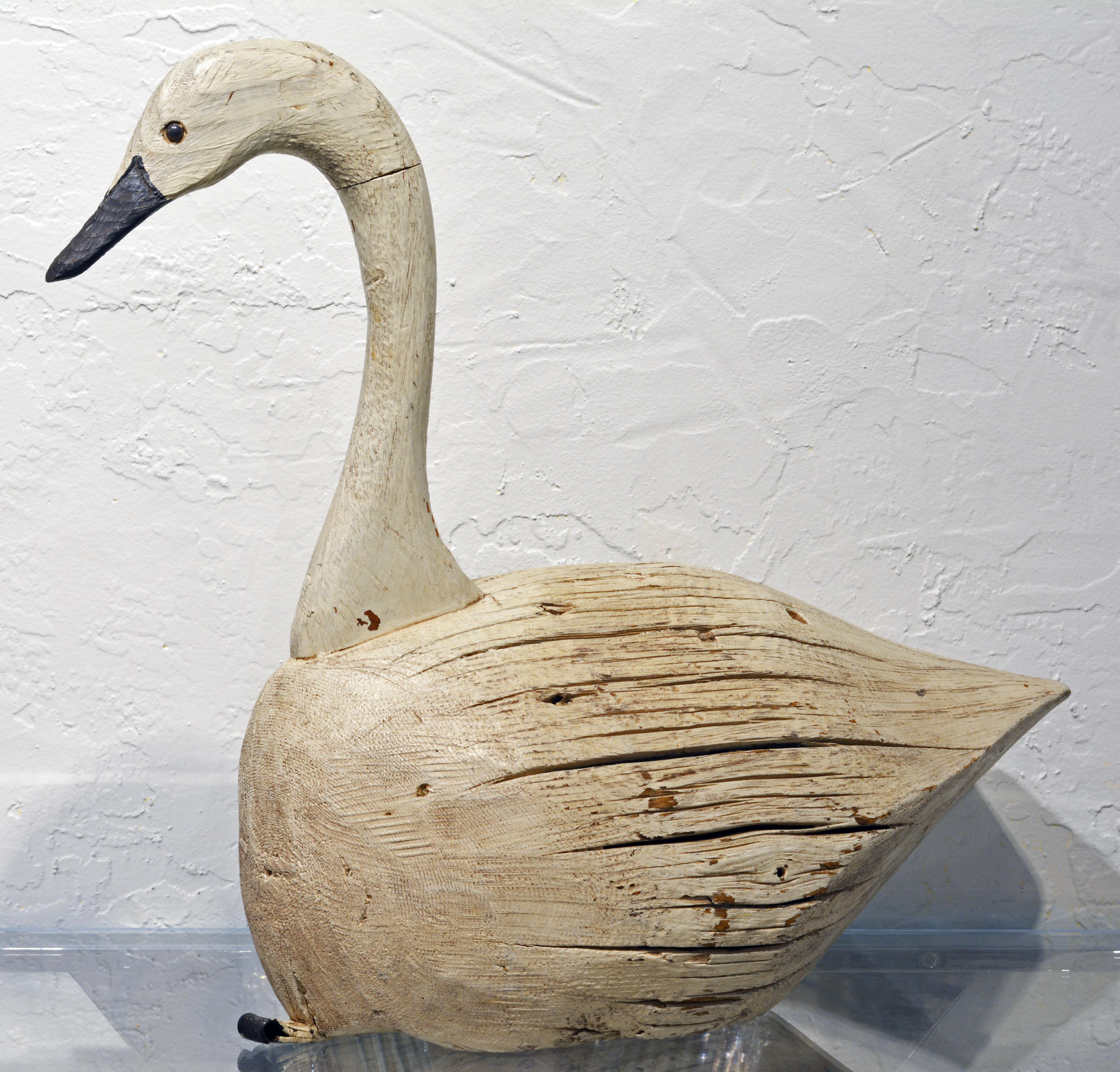 Created in the rustic Folk Art style this large carved and painted decoy swan makes a beautiful sculptural accent in a country home.