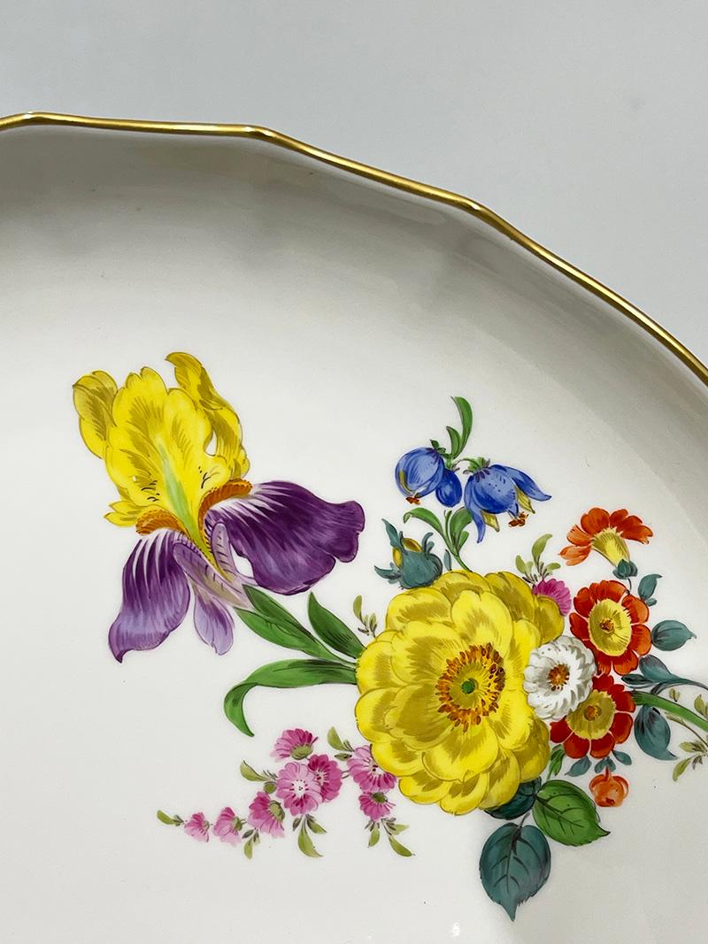 A 20th century Meissen porcelain set, Germany

A porcelain set, manufactured by Meissen in Germany. The set painted with bright colors, red, blue, yellow and green in floral pattern. The porcelain is marked with the blue crossed sword mark. Some