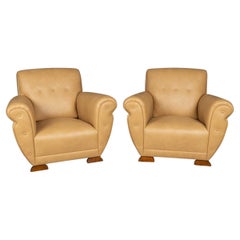 A 20th Century Pair Of English Beige Faux Ostrich Skin Leather Armchairs c.1960