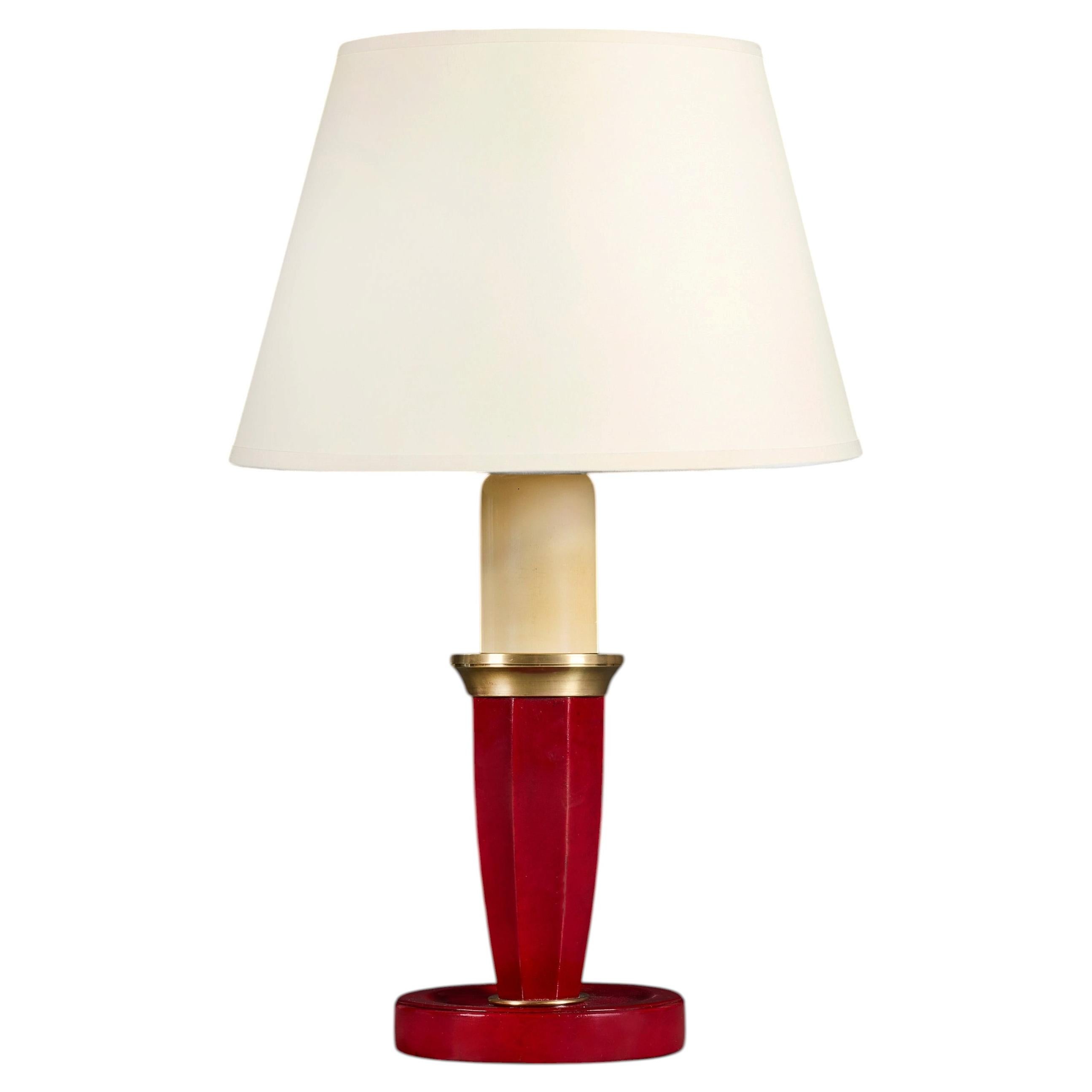 A 20th Century Red Leather Desk Lamp after Adnet