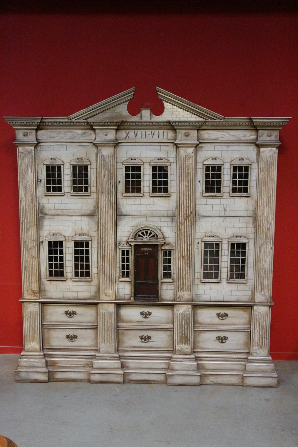 A special dollhouse in a very large format. In the form of an impressive building. Imitated in detail and beautifully finished. It can be used for various purposes, such as a bookcase.

Origin: England

Period: Mid-20th century

Size: W. 190