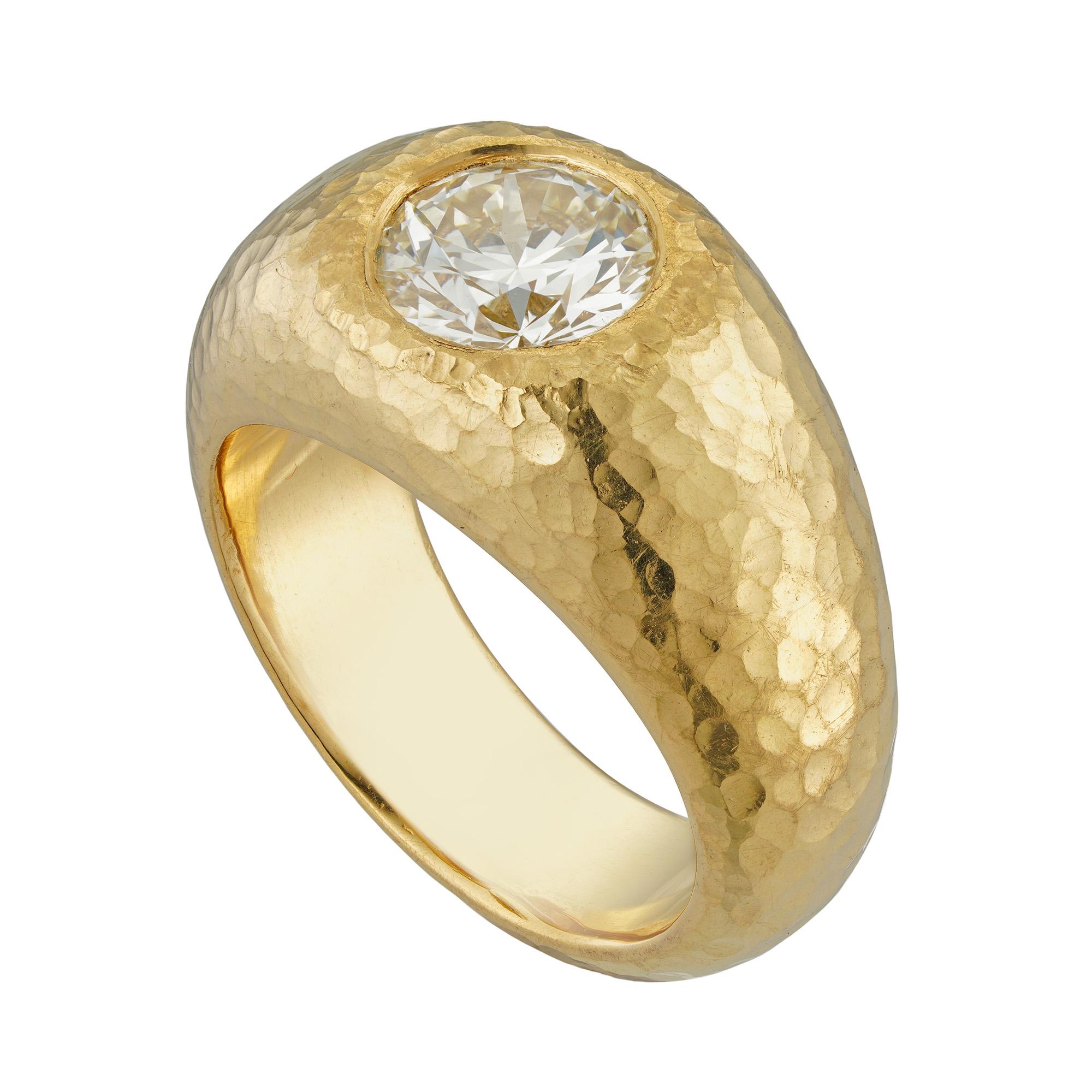A 22ct gold diamond flush-set ring, the round brilliant-cut diamond weighing 1.84 carats, accompanied by GIA report, stating the diamond to be of O-P colour and VS1 clarity, flush-set in yellow gold mount ring with planished finish, hallmarked 22ct