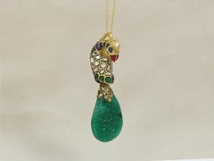 A 22K gold Indian Emerald and Diamond polki peacock pendant