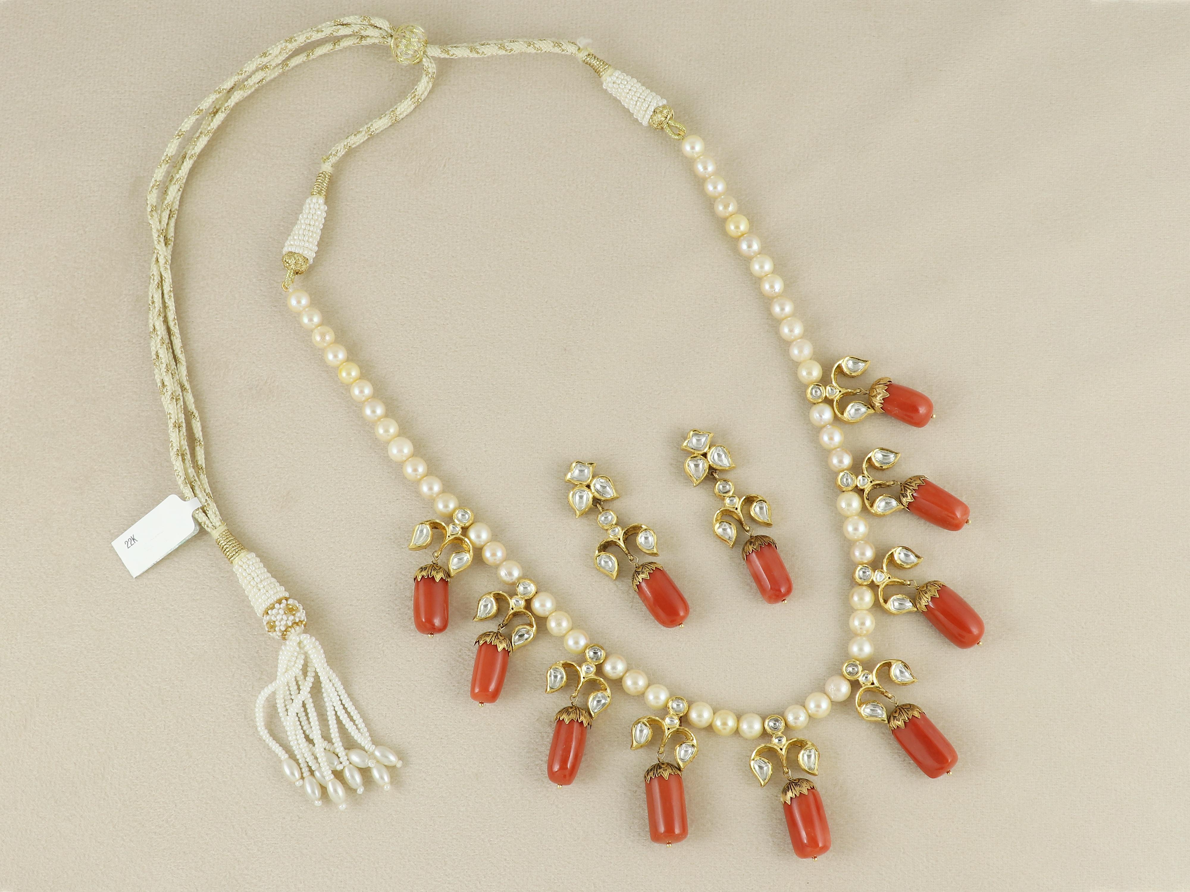 A rare fusion of natural beauty and royal craftsmanship, this striking necklace is handcrafted using top-grade Italian coral, each piece capped in pure 22K gold using the intricate Partaz technique. Every gold cap is designed as a trio of delicate