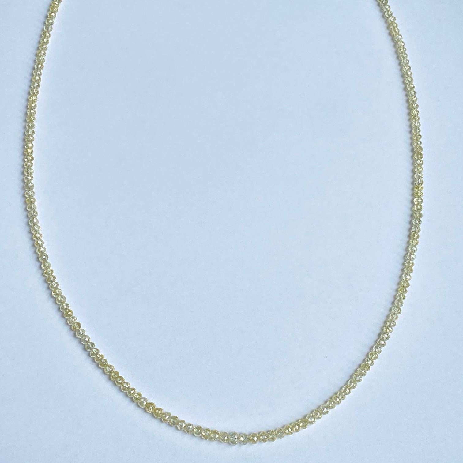 An 18 inch strand of 23.83 ctw yellow faceted diamond beads, with an 18k white gold diamond clasp. This strand was made and designed by llyn strong.