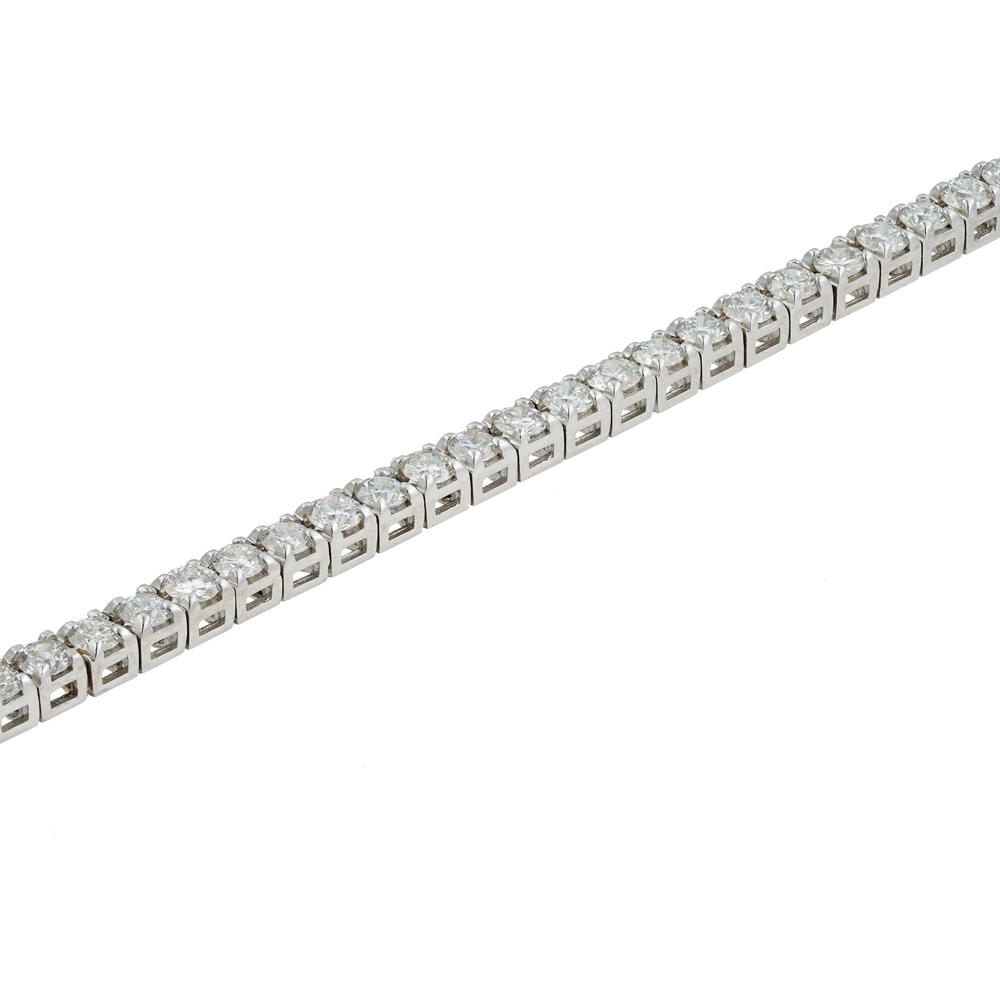 A diamond line bracelet set with 72 round brilliant-cut diamonds, weighing a total of 2.97 carats, all four claw-set to a white gold articulated mount with a concealed push clasp, hallmarked 18ct gold London 2016, bearing the Bentley & Skinner