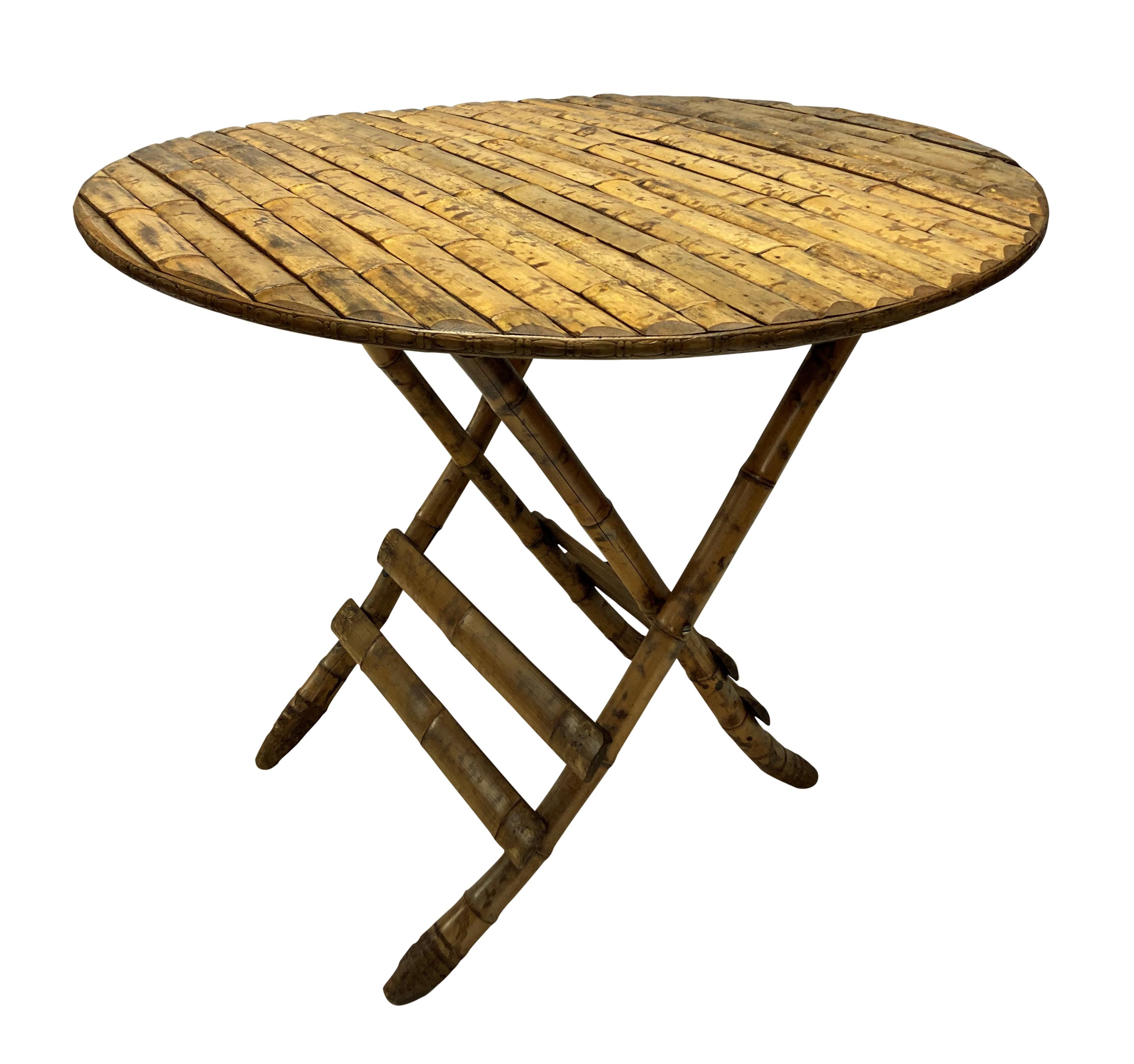 A stylish French folding table with bamboo legs and a slatted bamboo veneered top and decorative edge.