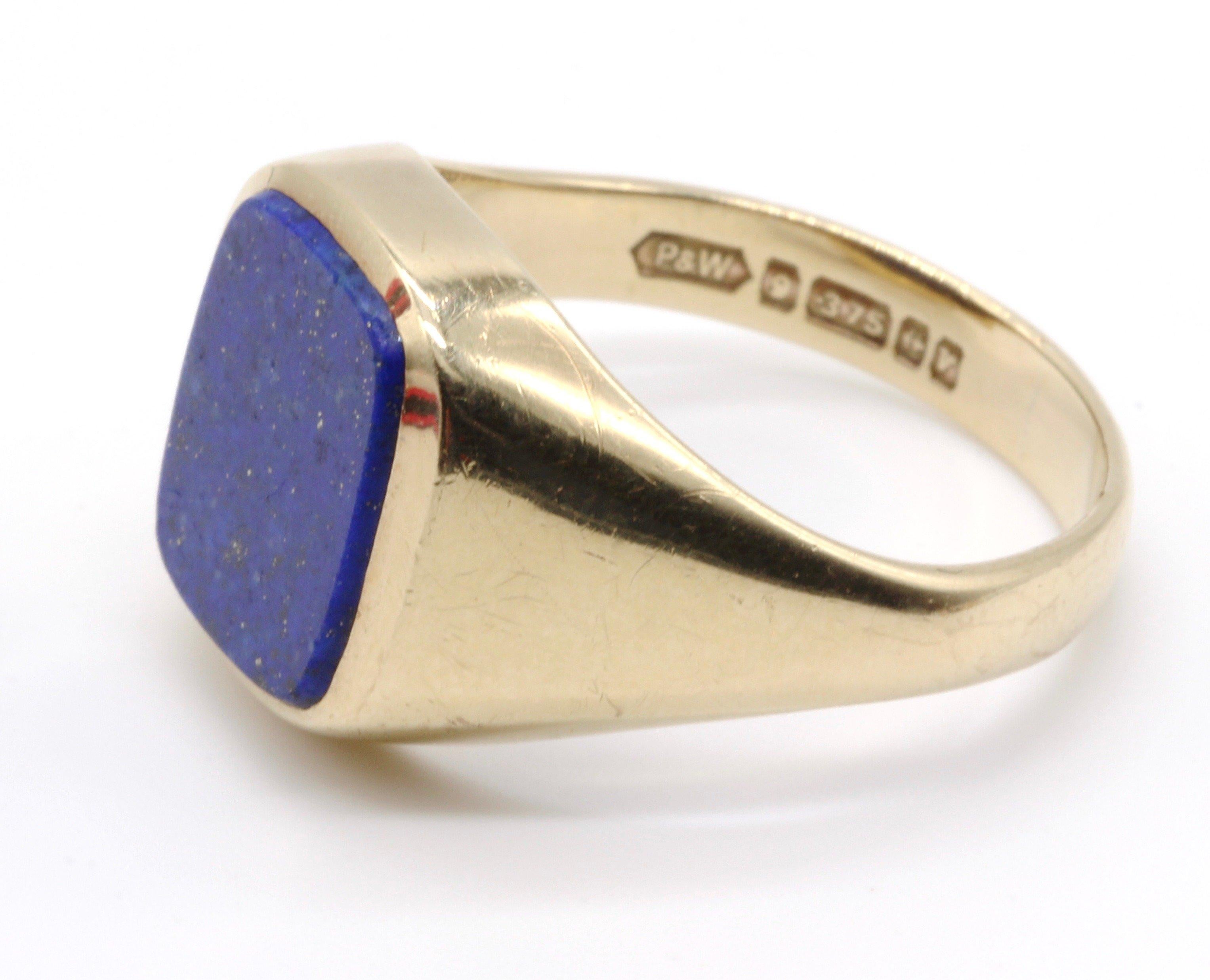 A fine quality 9 Karat yellow gold and lapis lasuli square faced Gentleman's signet ring.
Size  UK   S  
         USA   9.0
Weight 6.36gm.   Diameter of face 14mm.
Hallmarked Birmingham  UK  1970-71