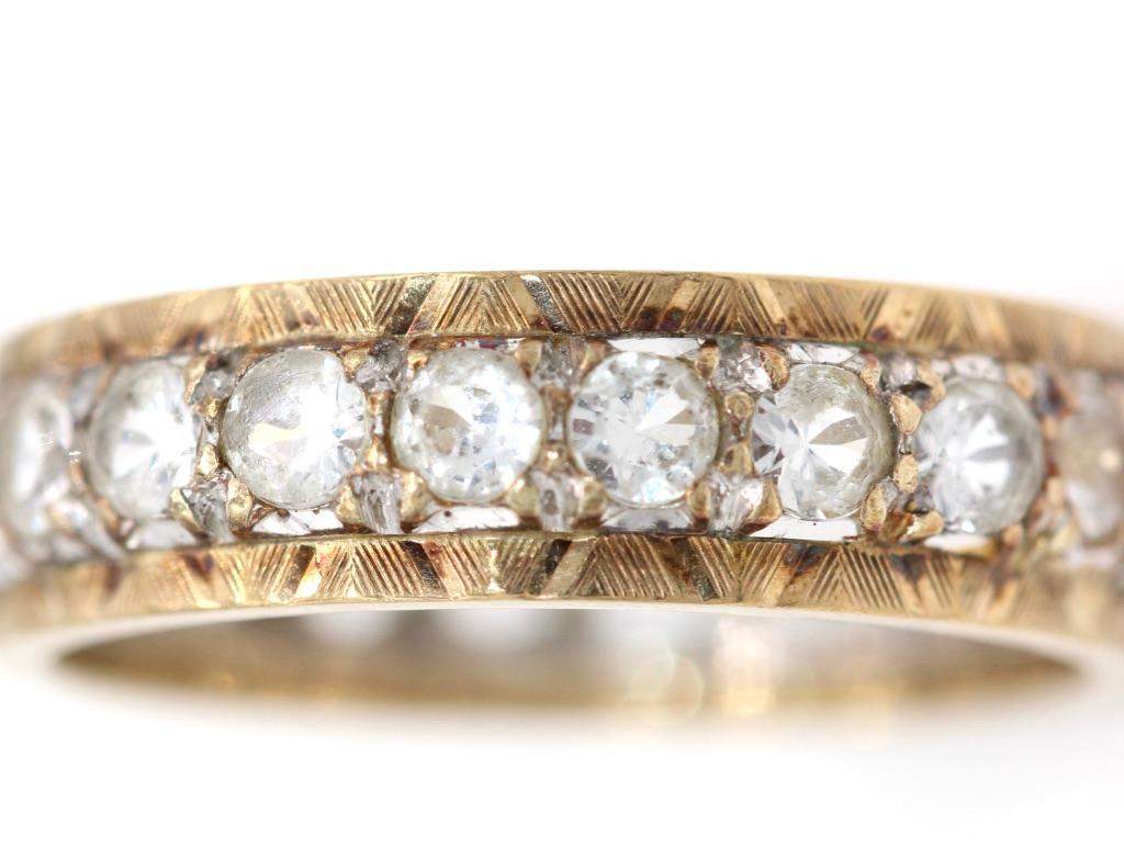 Modern 9 Kt Yellow and White Gold Diamond Eternity Ring For Sale
