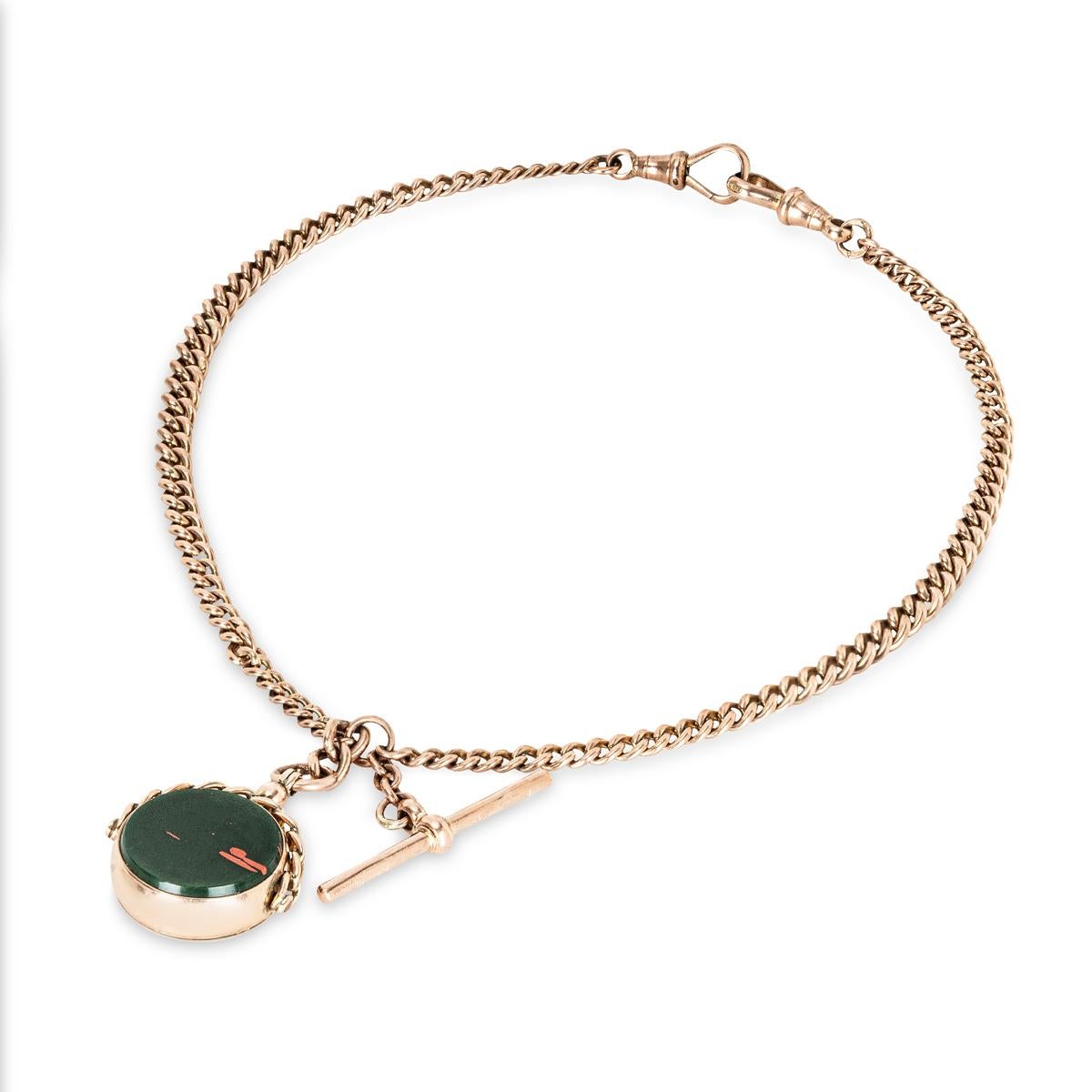 A 9ct Rose Gold Curb Link Pocket Watch Chain with Blood Stone Swivel Seal. C1900s.

This beautiful example of English craftsmanship, manufactured in 9ct rose gold graduated curb link pocket watch chain, with a fine matching swivel fob seal made in