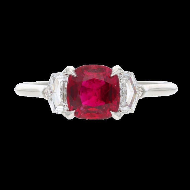 Centering a ruby, flanked by 2 shield cut diamonds.
 - Ruby weighs 1.41 carats 
- Diamonds weighing a total of approximately 0.85 carat 
- Platinum
 - Total weight 3.90 grams
 - Size 6 
- Accompanied by AGL report no 1086233, dated 10 August 2017,