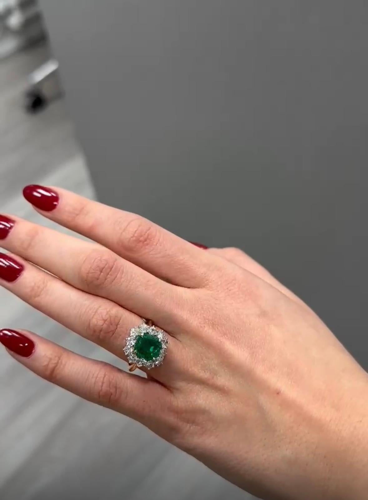 A AGL Certified 18 karat white gold  2.98 Columbian Emerald Embedded with 2.10 carat side diamonds 