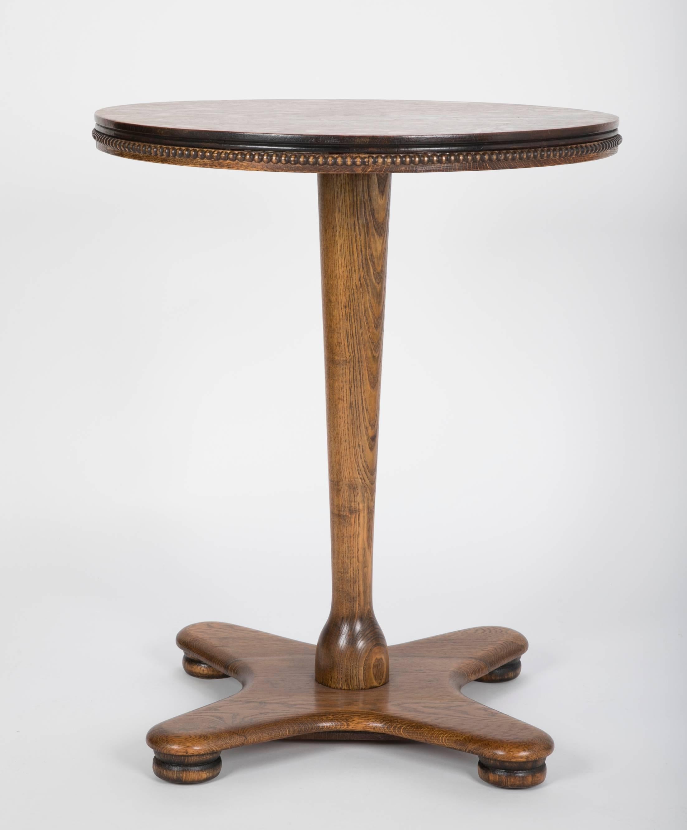 An Arts & Crafts quarter sawn oak side table, with interesting amoeba form base.