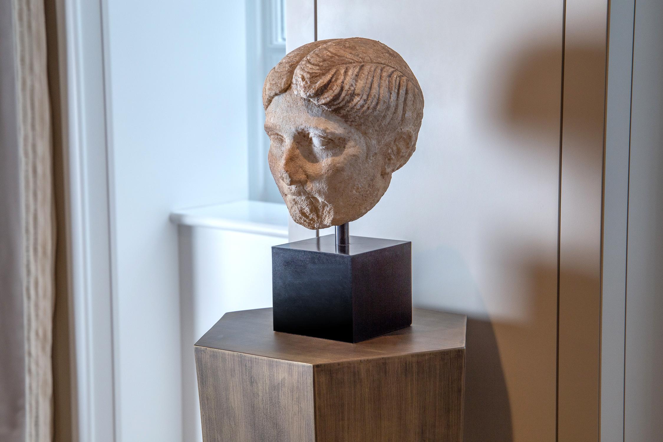 Julio-Claudian period, 1st century BC-1st century AD

Measures: Height with stand 37cm

A Roman lady represented with an oval face characterized by a beautifully rounded chin and slightly-full
lips, the eyes are framed by thin modelled brows,