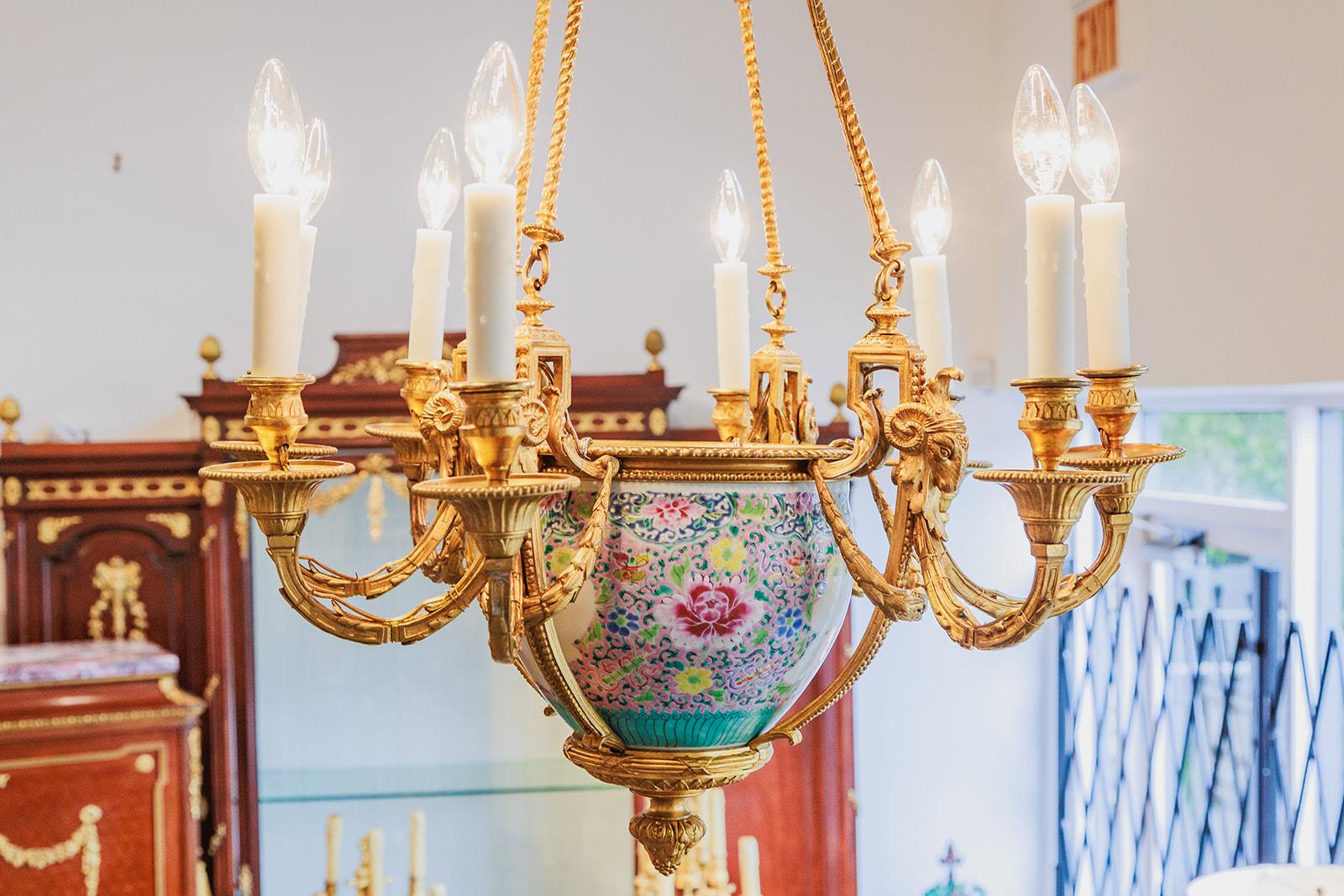A fine and rare 19th century French Louis XVI gilt bronze chandelier with rams head design. The center has a porcelain 18th century Qianlong vase.  Beautiful quality 
