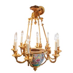 A and rare 19th c French Louis XVI gilt bronze chandelier with a porcelain vase