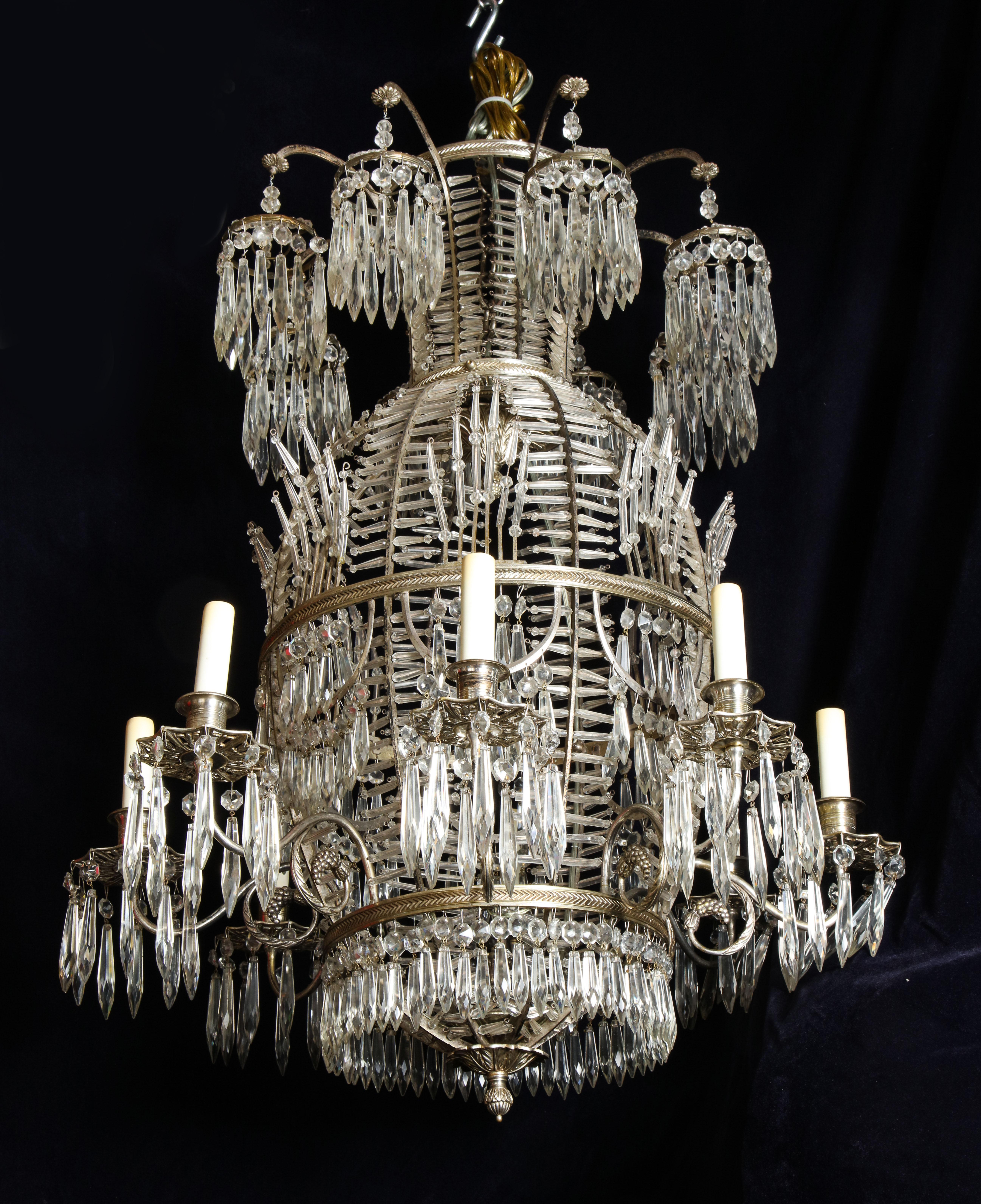 A very unique antique Russian neoclassical balloon form silvered bronze, cut crystal and glass multi light chandelier of superb quality. This rare chandelier is embellished with silvered bronze arms, cut crystal prisms and further adorned with