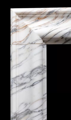 A arabescato marble bolection mantel by Ryan & Smith