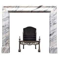 A arabescato marble bolection mantel by Ryan & Smith