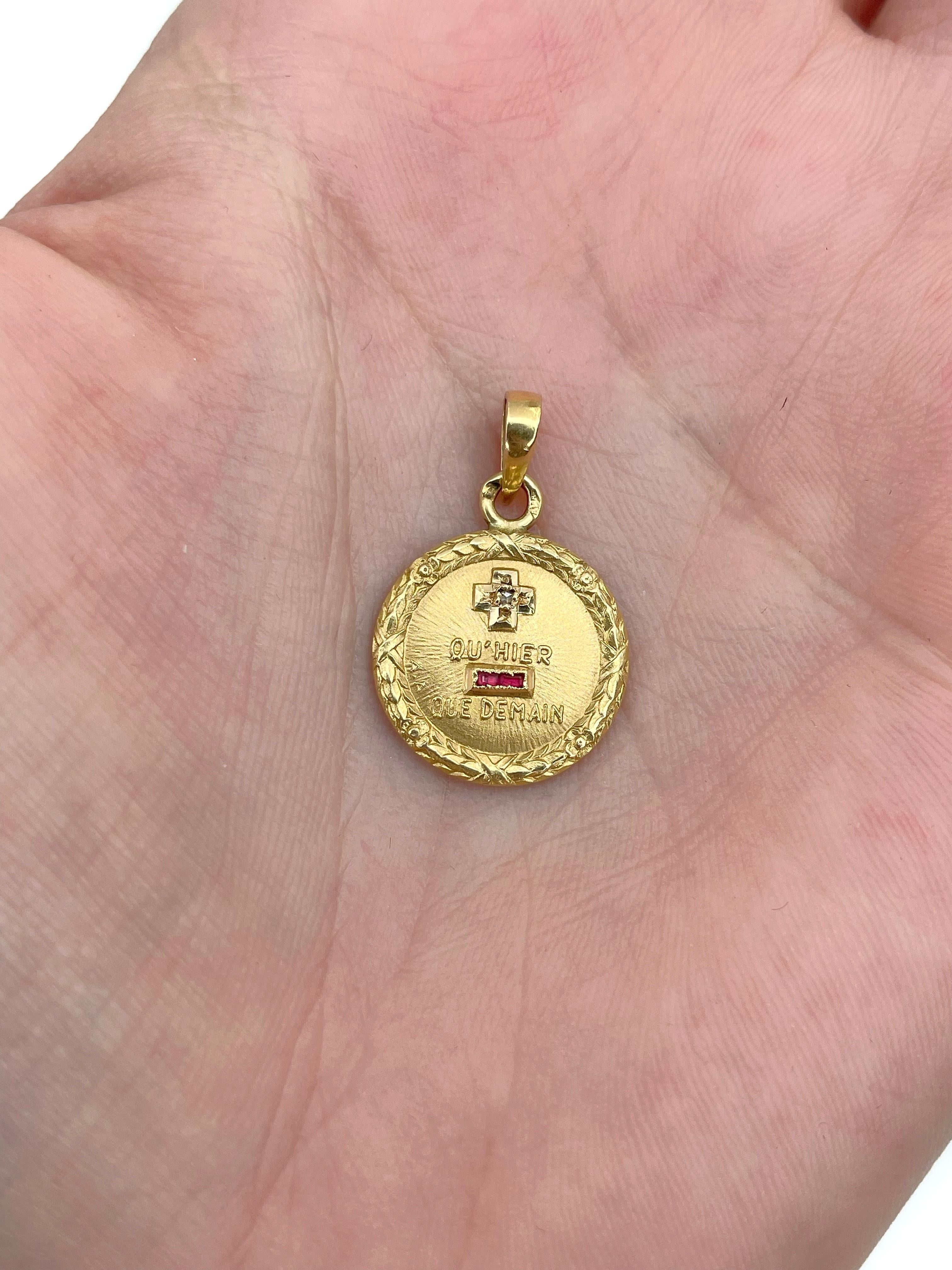 This is a love charm pendant crafted in 18K yellow gold. Circa 1910.

The pendant is created by French jeweller Alphonse Augis in response to the love poem written by Rosemonde Gerard. It depicts the signs of plus and minus. Together with the words