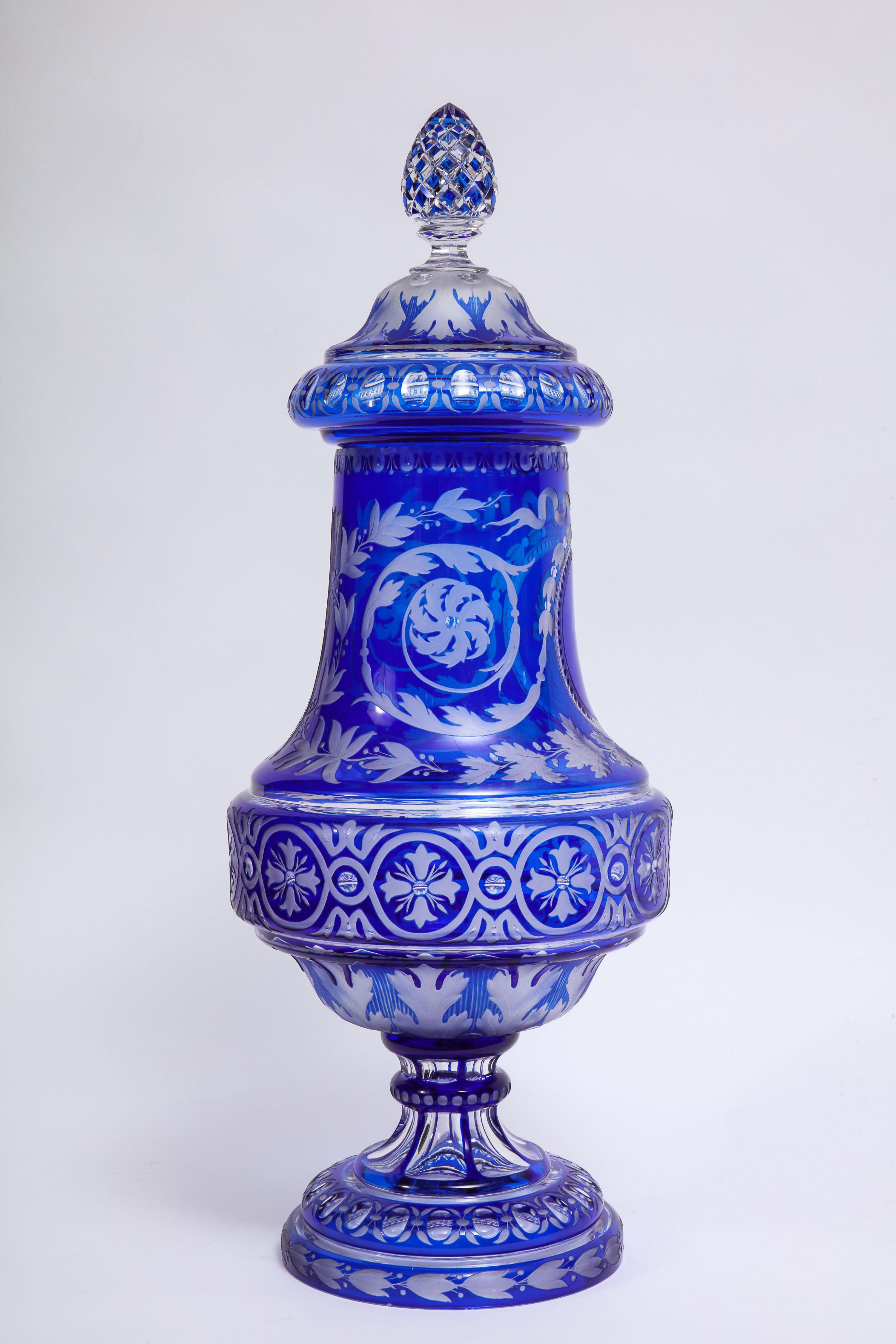 A spectacular and important 19th century Louis XVI style baccarat double-overlay blue-over-clear wheel carved, etched and acid washed covered vase, attributed to Jean Baptiste Simon. This vase is exceptionally made with double-overlay