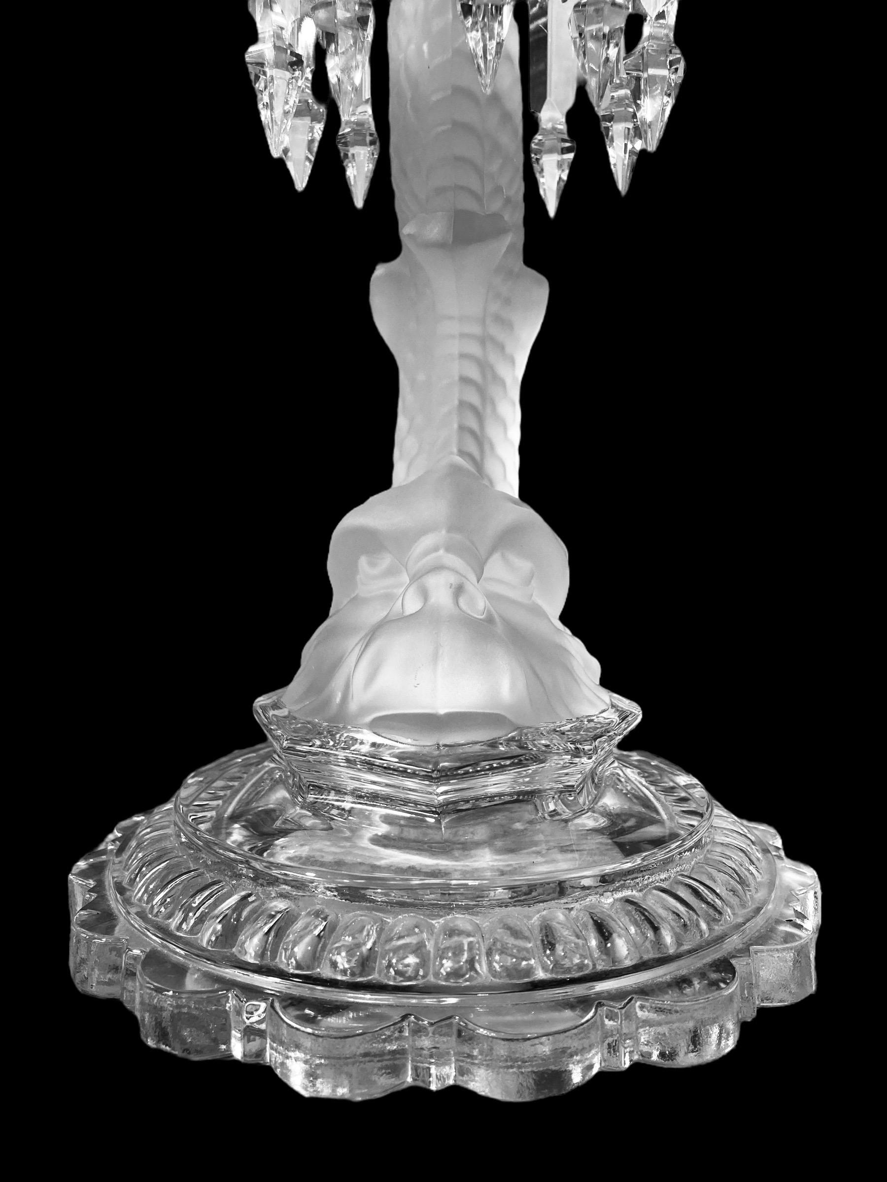 A Baccarat Crystal Lustre Candlestick with etched glass hurricane shade and frosted figural dolphin. Both shade and base are signed Baccarat and are in virtually unused condition

.The candlestick can be used with or without the shade