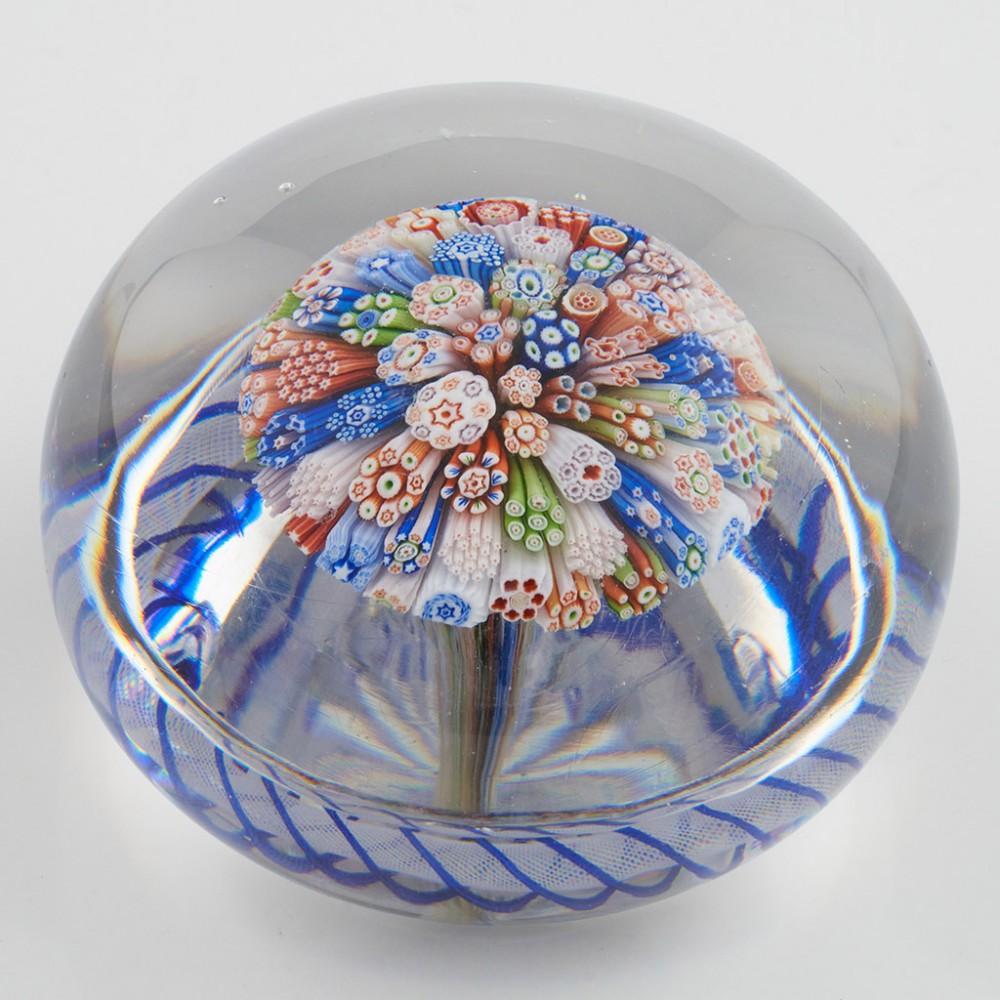 Heading : A Baccarat Mushroom Torsade Millefiori Paperweight c1850
Date : c1850
Origin : France
Features : Millefiori close packed mushroom with outer blue radial torsade within a clear ground
Marks : None
Type : Lead
Size : 7.7cm diameter, dome