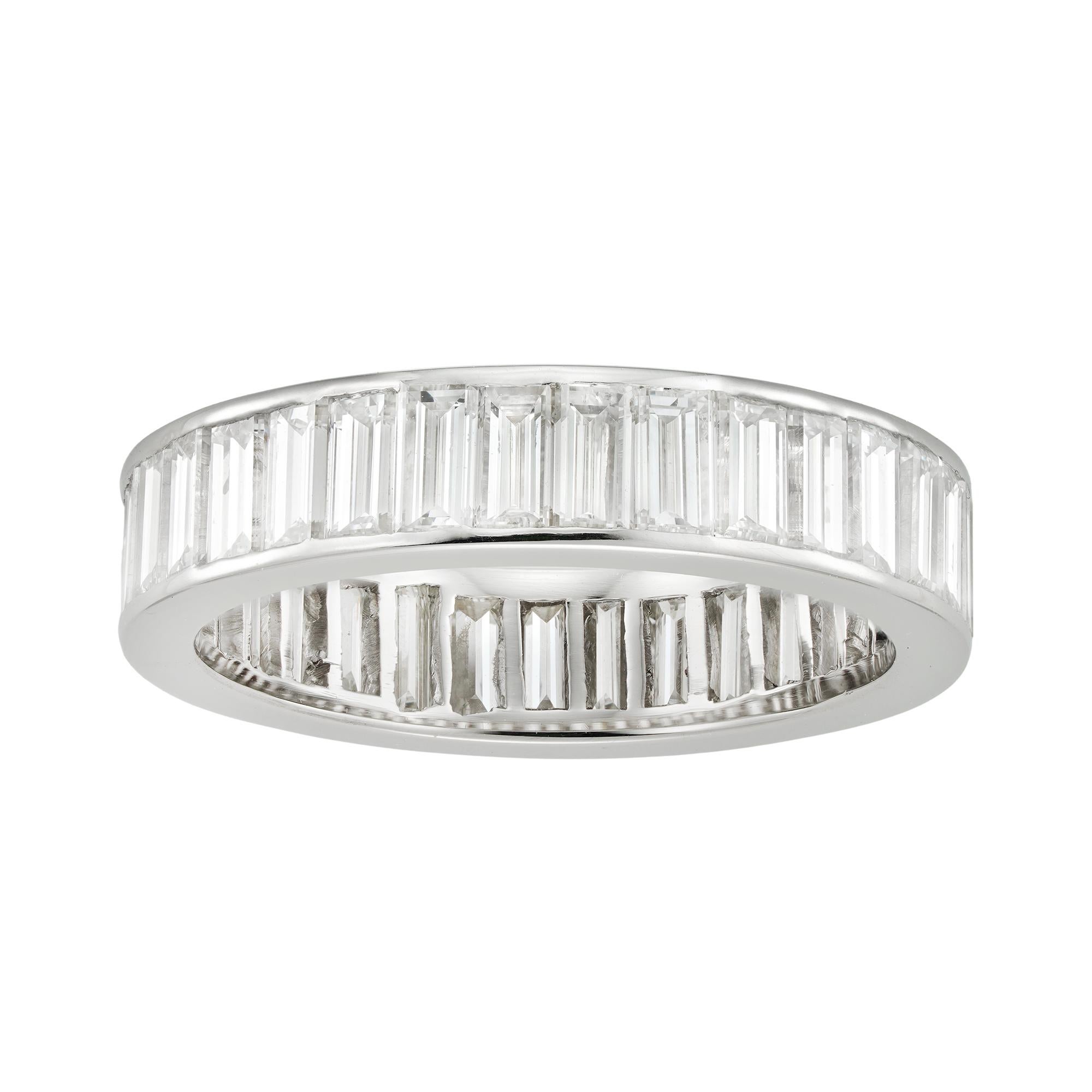 A baguette-cut diamond-set full eternity ring, the 33 baguette-cut diamonds estimated to weigh 3.2 carats in total, channel-set in platinum mount, later hallmarked 950 Platinum London, 2022 bearing the Bentley & Skinner sponsor mark, measuring
