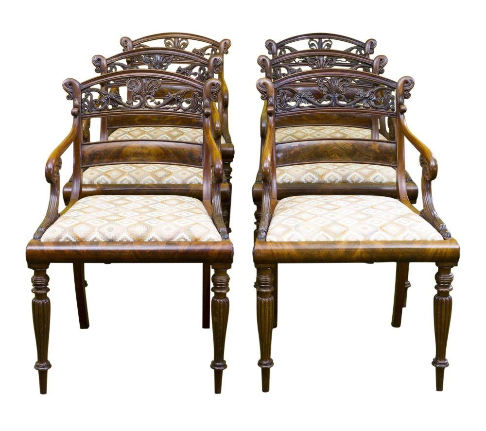 A rare Baltic set of 6 Empire-armchairs - design by Georg Friedrich Hetsch 

Mahogany richly carved and veneered

Side frame construction with inlaid upholstered seat on turned fluted legs, the back saber legs find their continuation in the