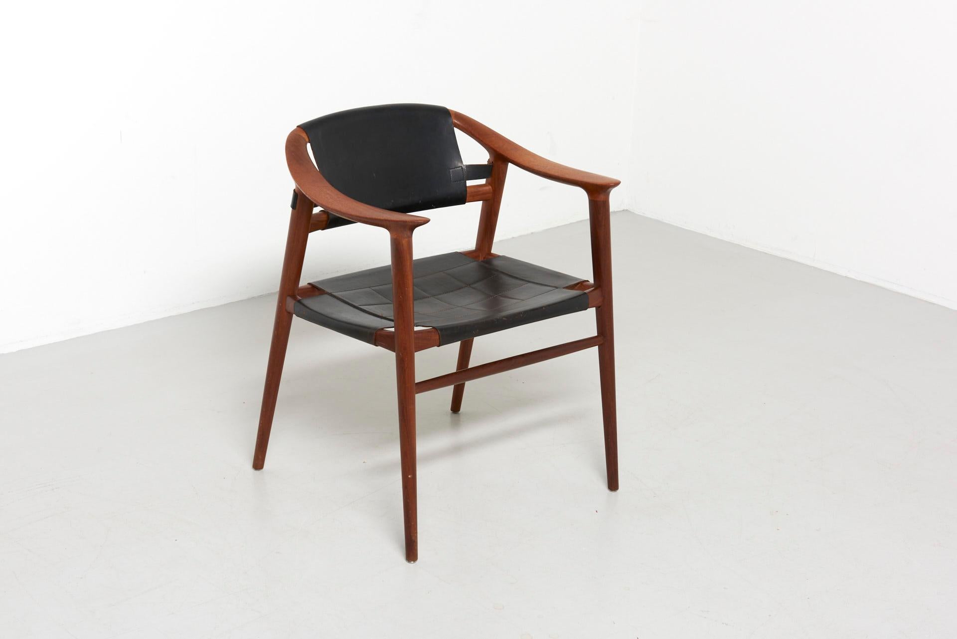 A rare 'Bambi' armchair designed by Rolf Rastad and Adolf Relling in Norway in the 1950s. Solid teak with black saddle leather. Made by Gustav Bahus in Norway.