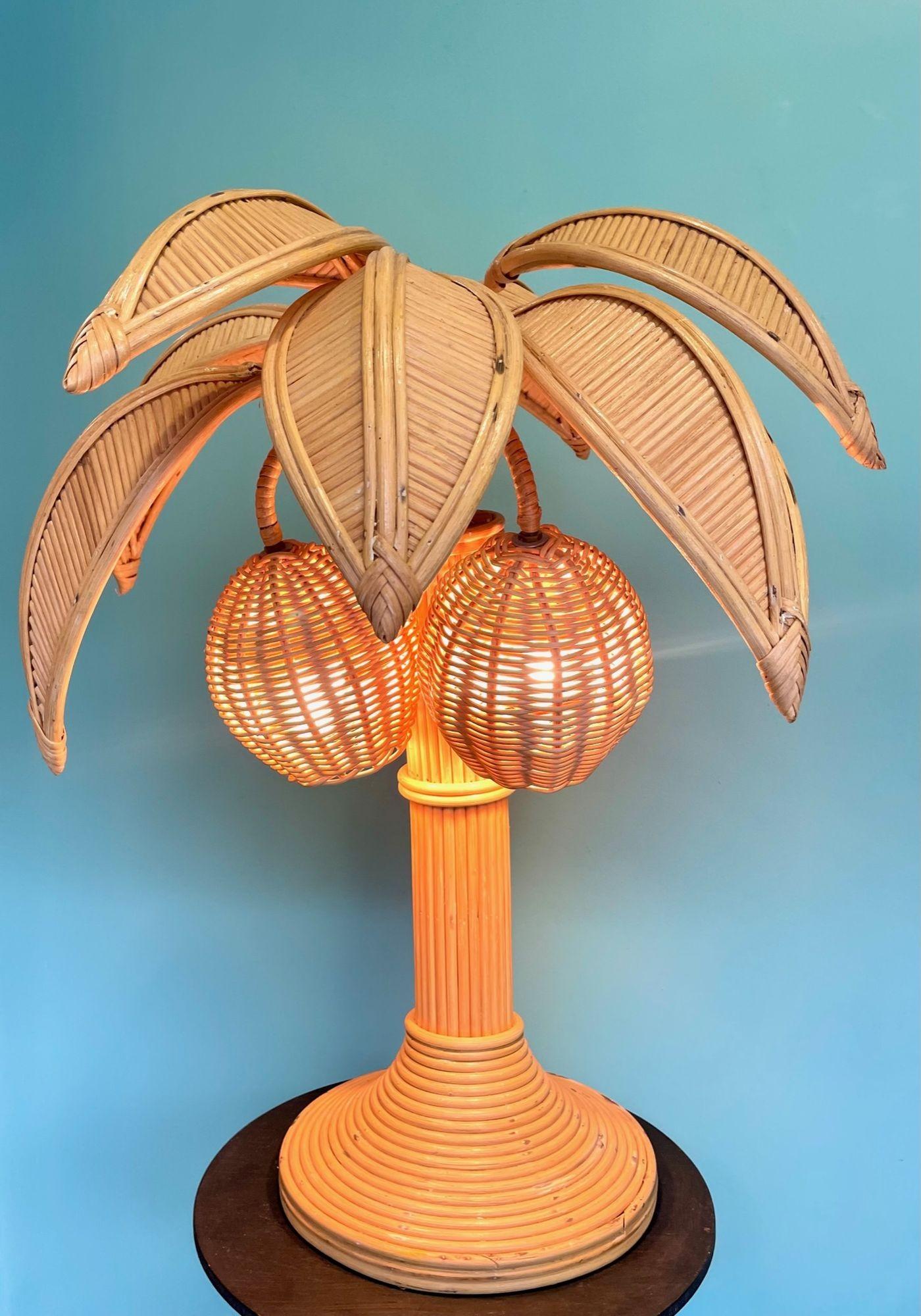 A bamboo palm tree table lamp with palm leaves and two coconut lights in the style of Mario Lopez Torres. Reiwred with new brass fittings and antique cord flex and switch.