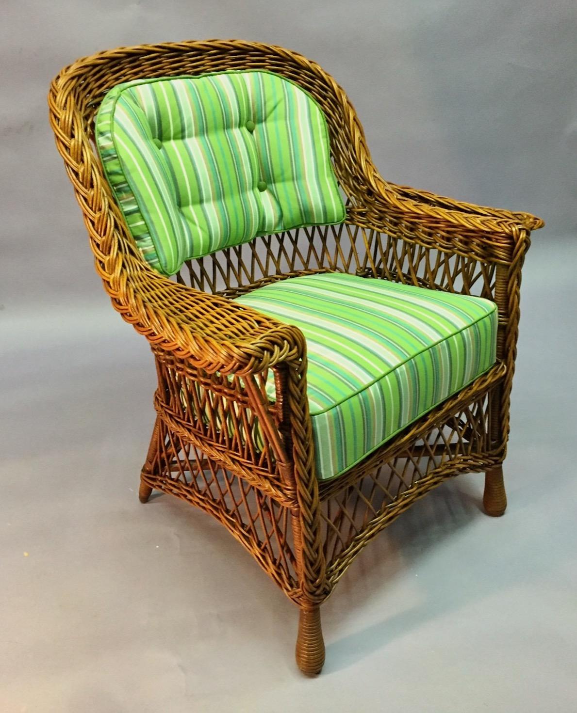 A Bar Harbor style wicker arm chair with a unique magazine pocket design in natural finish, American .C..1920 attributed to The Heywood Wakefield Company of Gardner, Ma. This unique arm chair is very sturdy in design with full Bar Harbor style