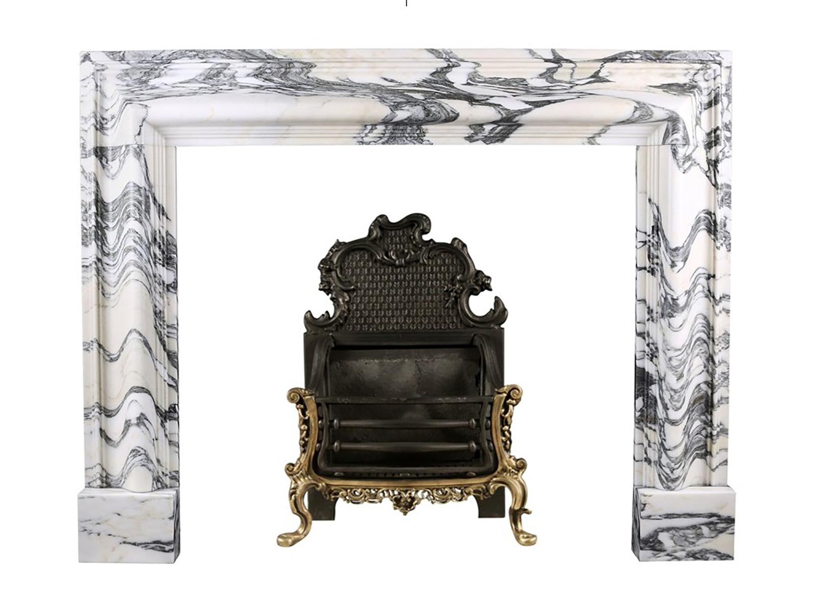 A Baroque Bolection Fireplace in Italian Arabescato marble fireplace

A Baroque style Bolection Fireplace surround of bold proportions with very finely carved columns with a rising ogee edging, which are supported on substantial footblocks, in